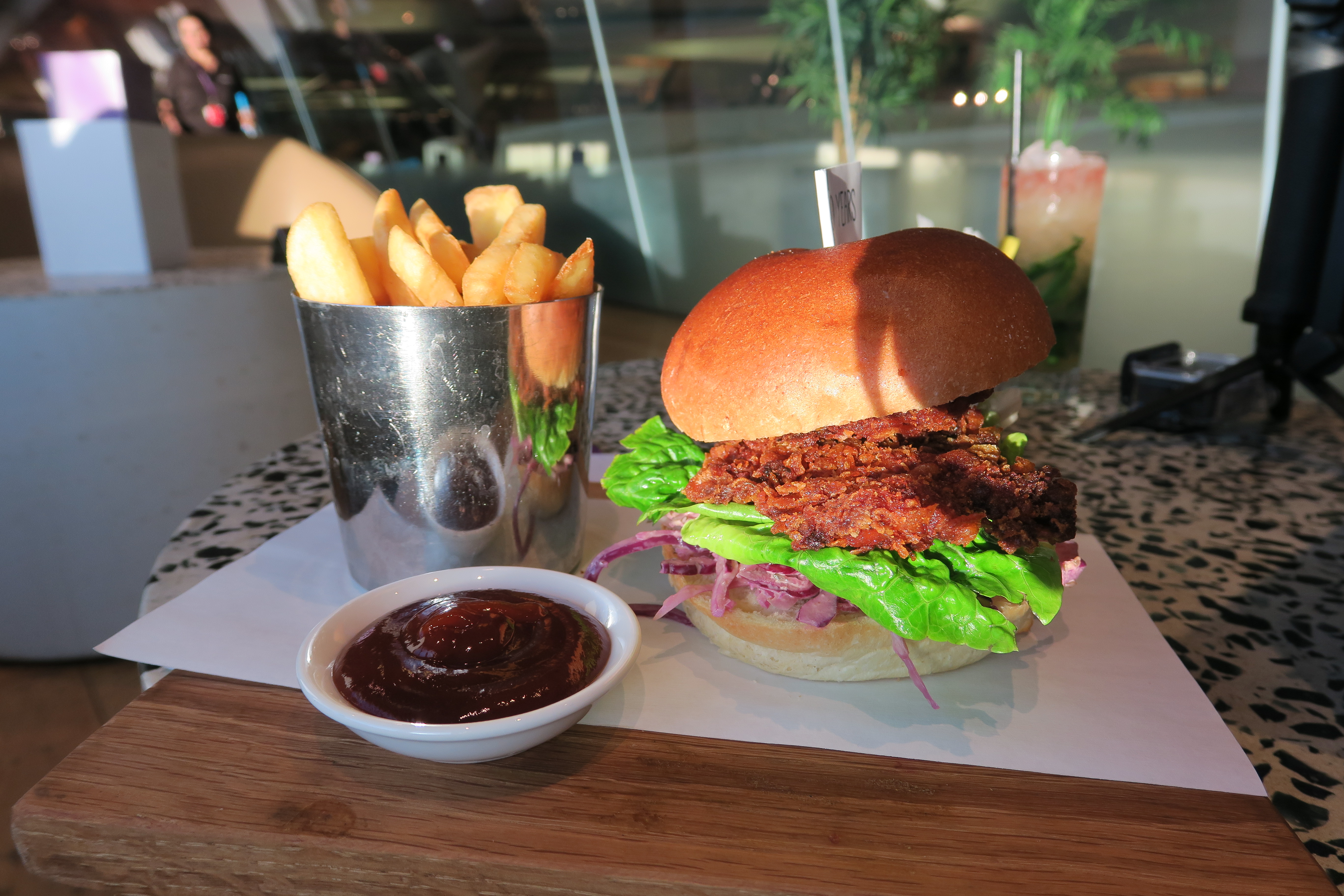 a burger and fries on a table