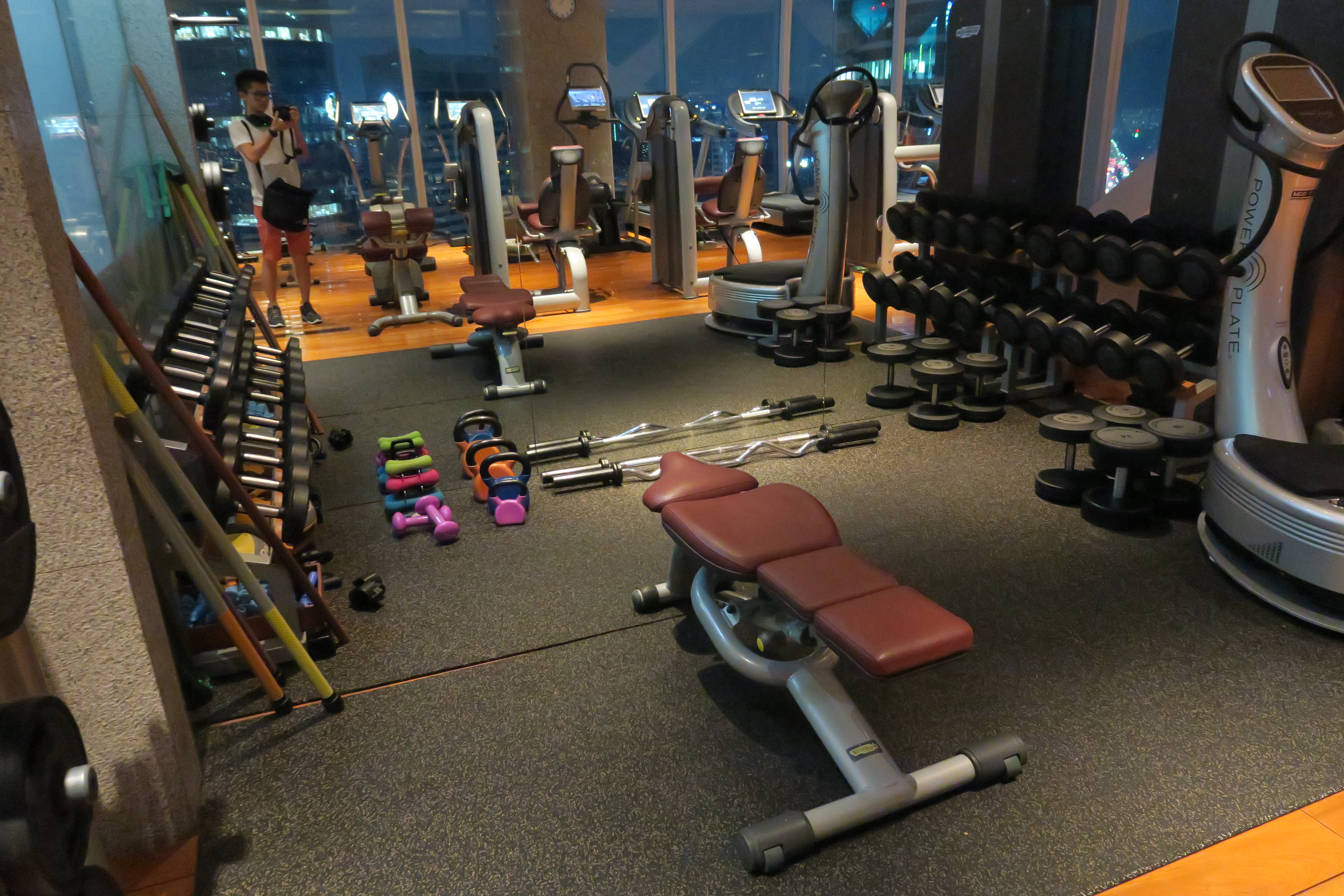 a large gym with many exercise equipment