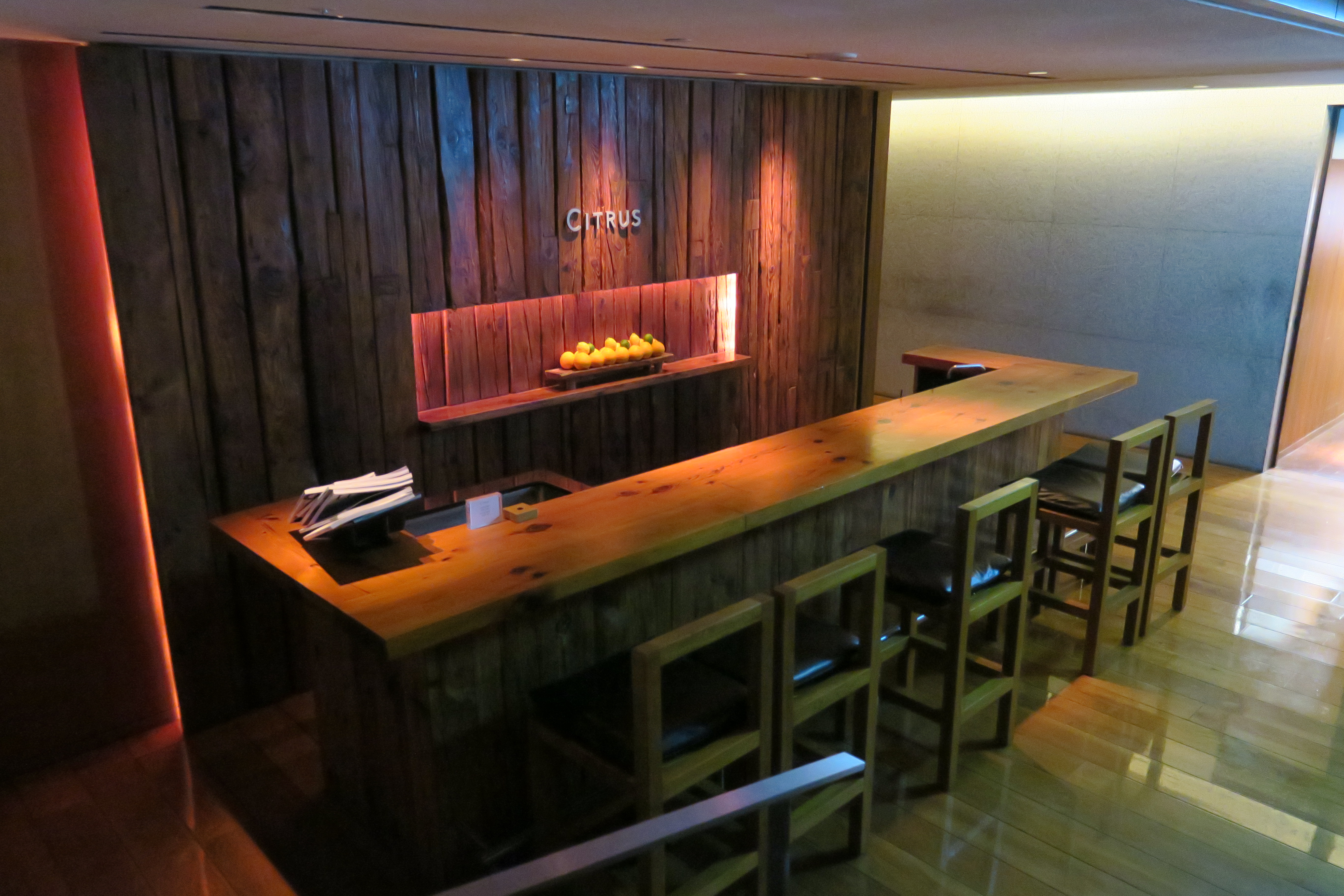 a bar with a counter and stools