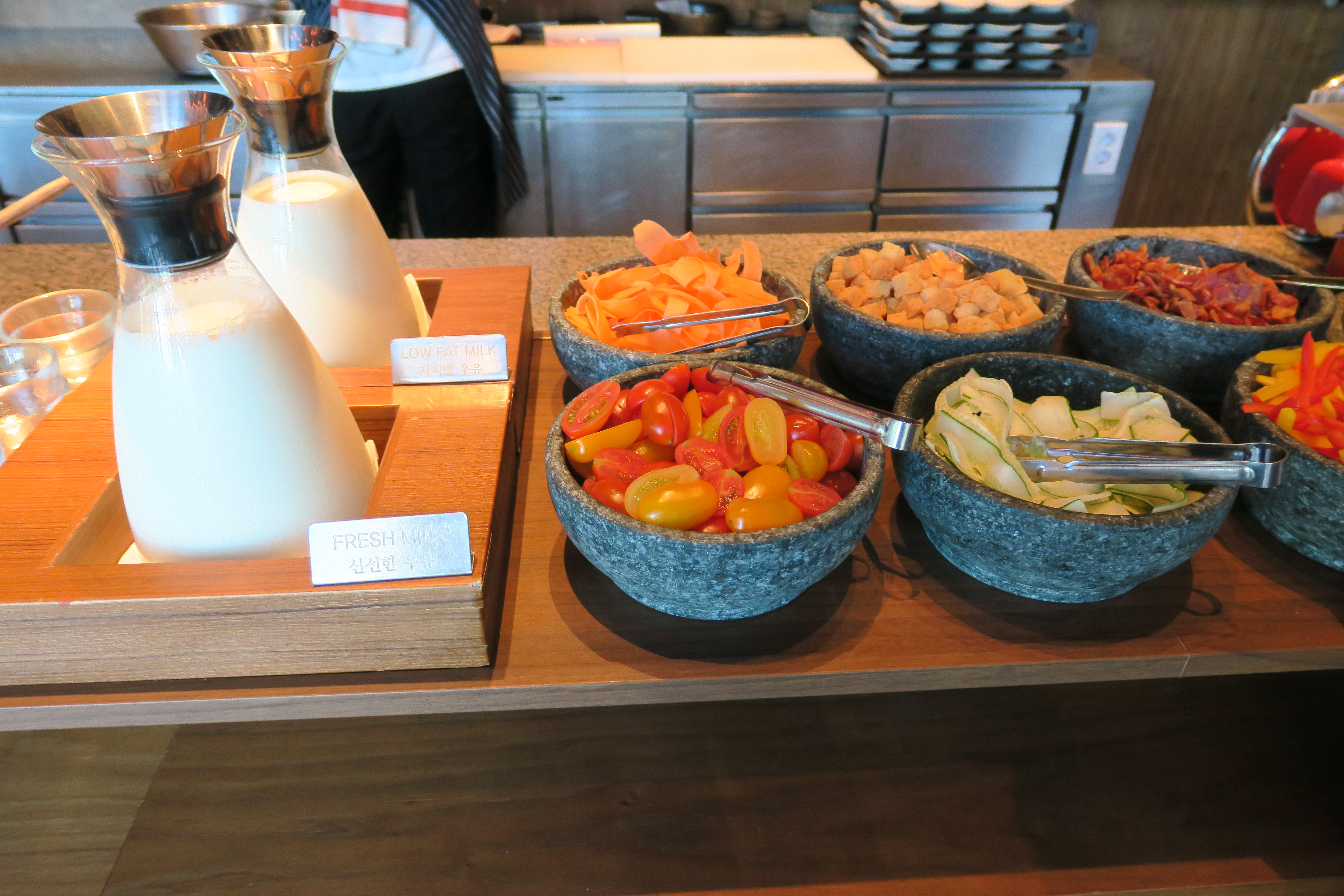 a variety of bowls of food on a table