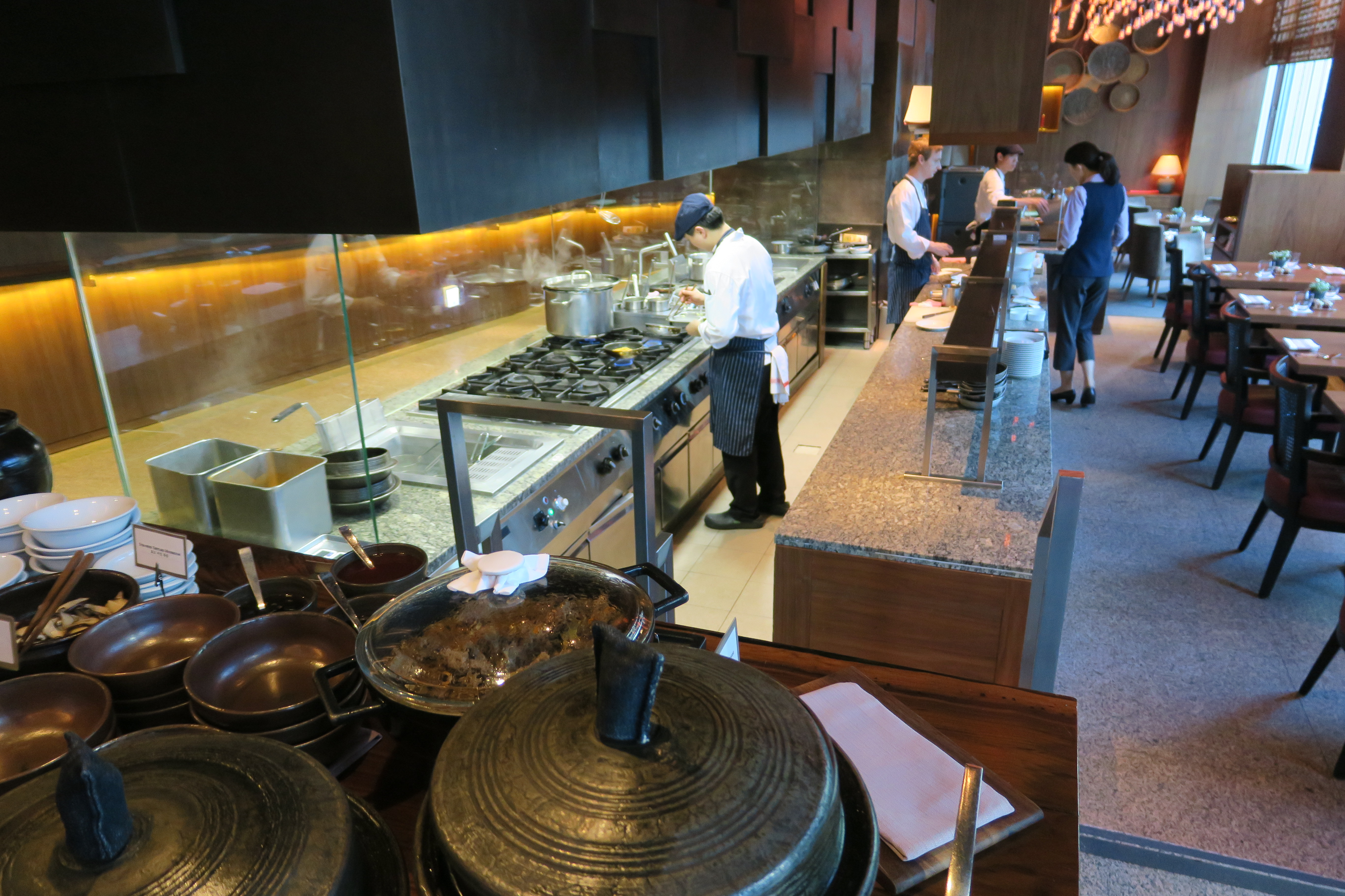 a group of people in a kitchen