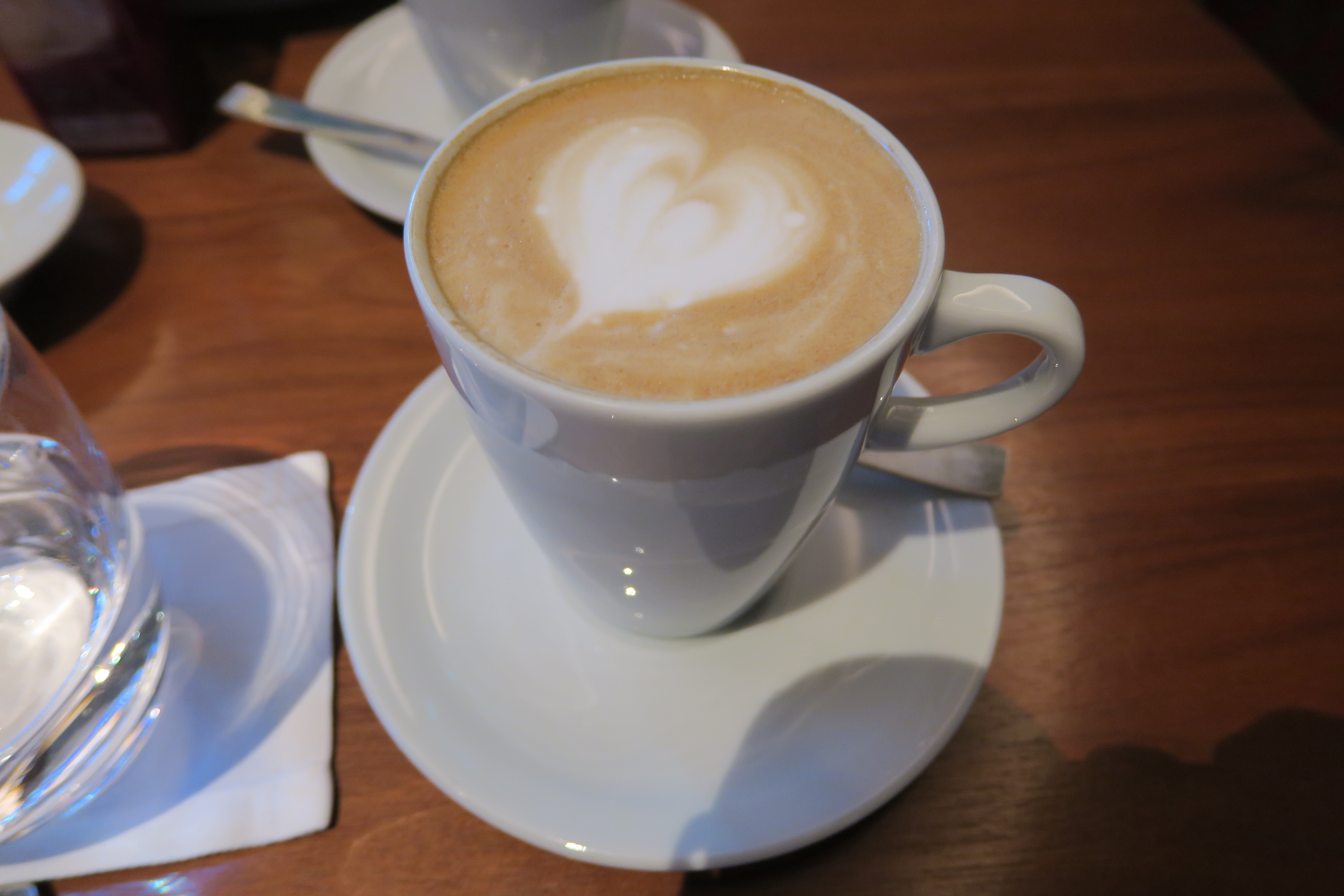 a cup of coffee with a heart in the foam