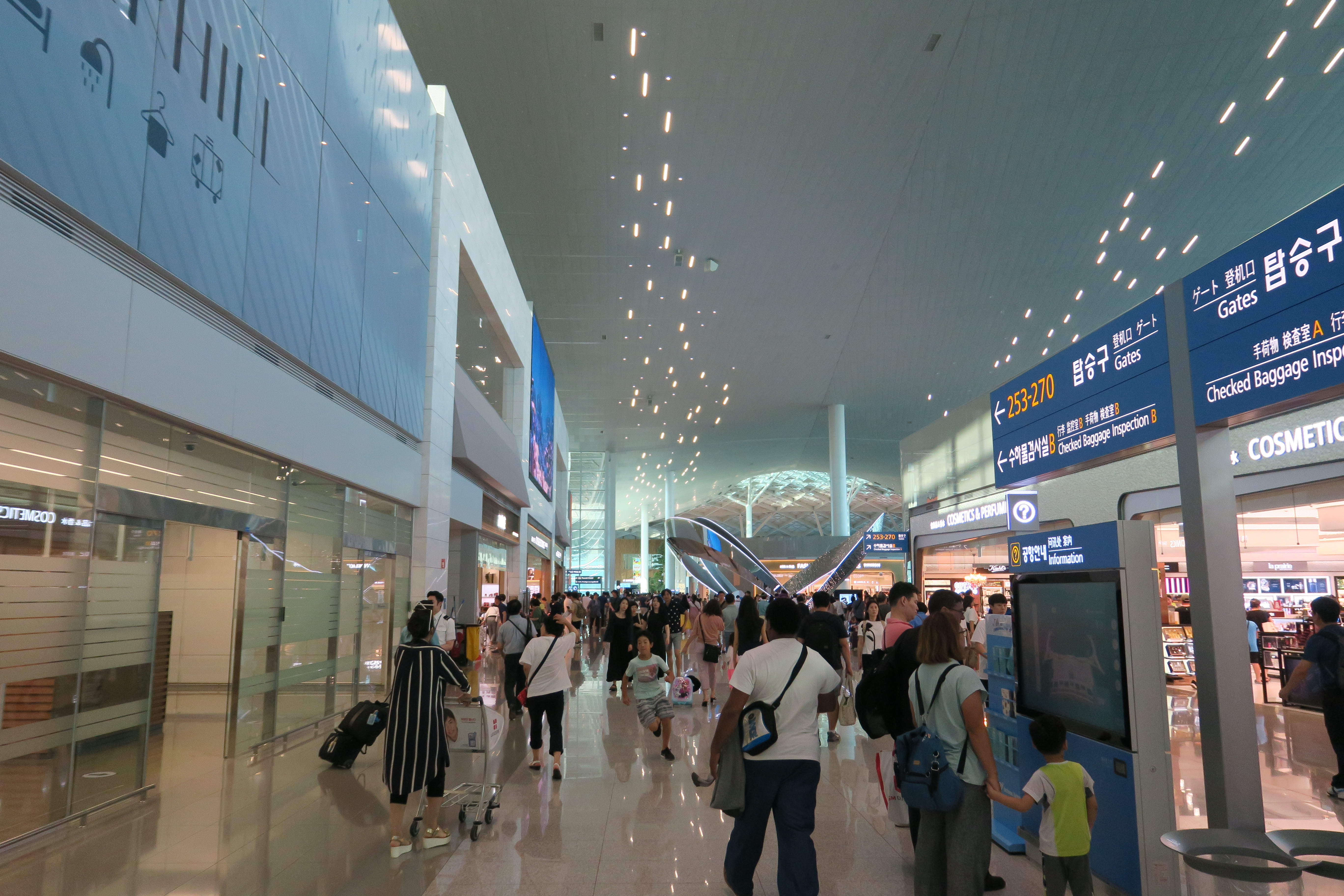 a group of people in a large airport