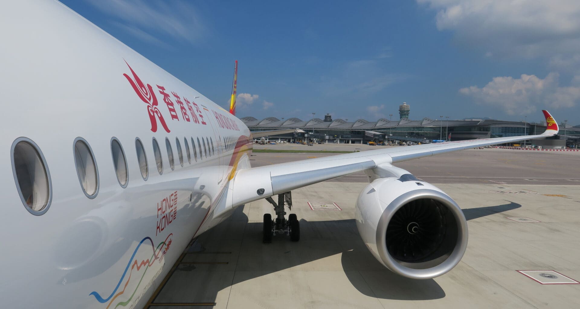 a white airplane with red writing on it