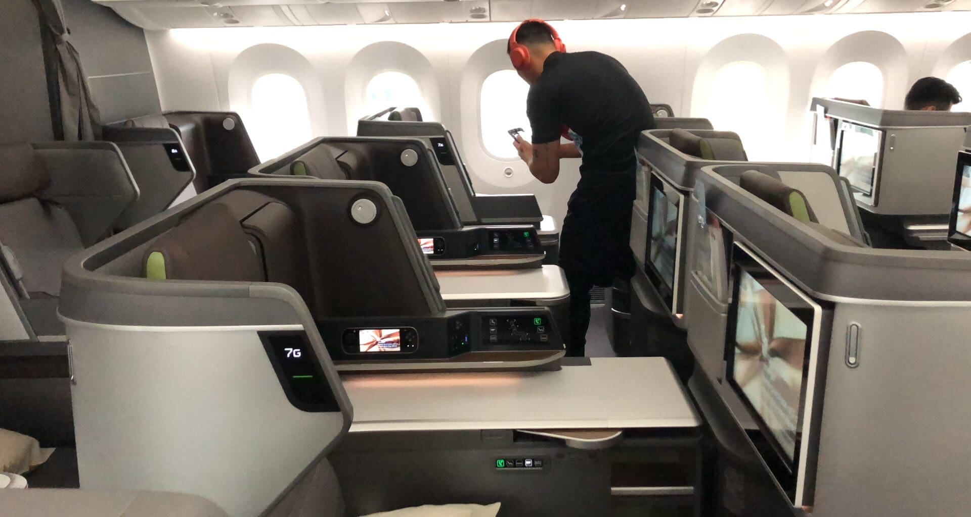 a man standing in an airplane