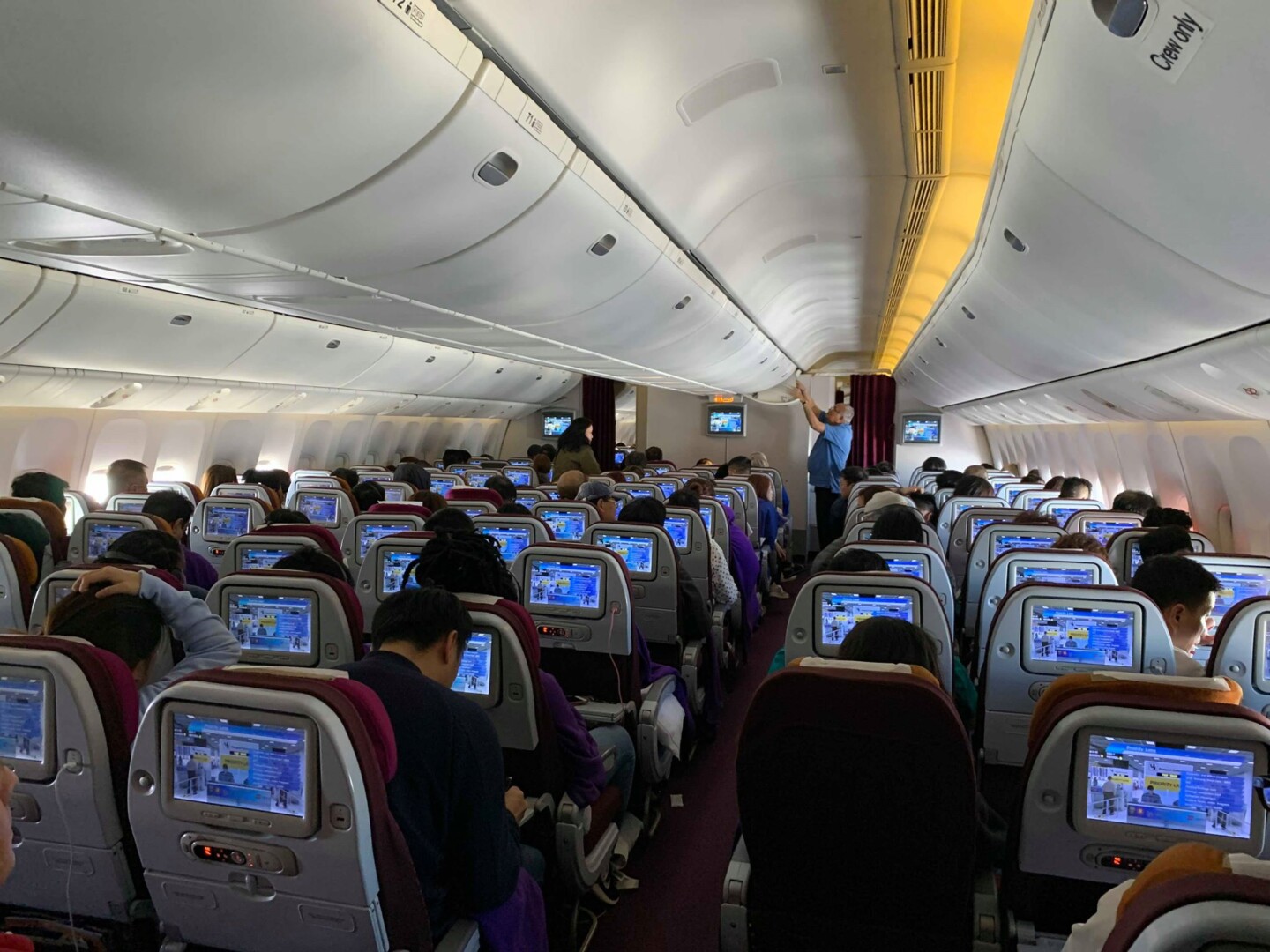 a group of people sitting in an airplane