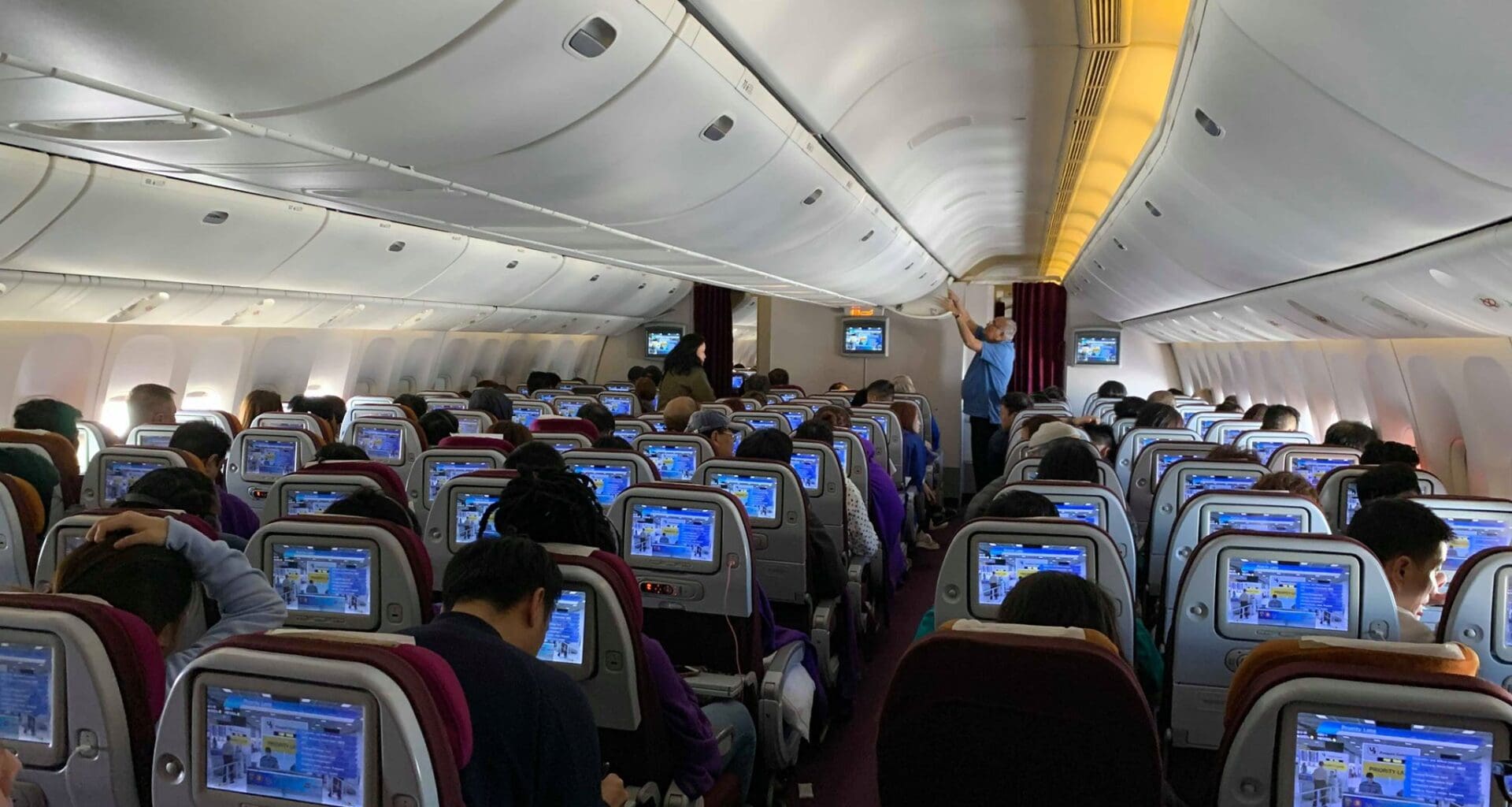 a group of people sitting in an airplane
