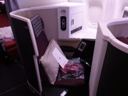 a seat with a pillow and a pillow in the middle of a seat