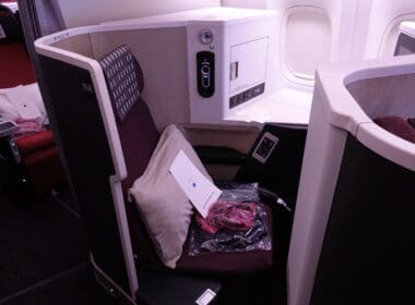 a seat with a pillow and a pillow in the middle of a seat