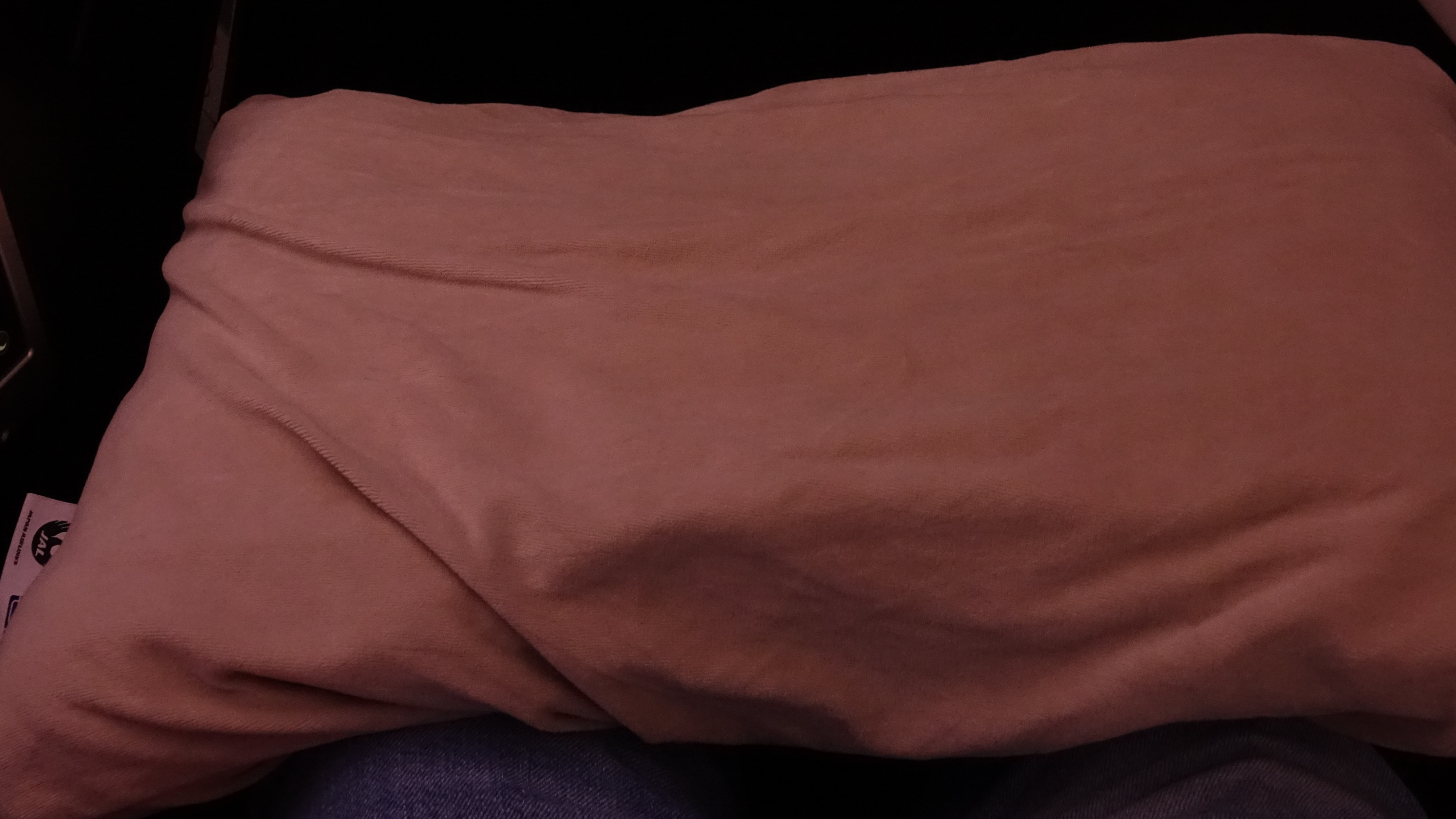 a brown blanket on a person's lap