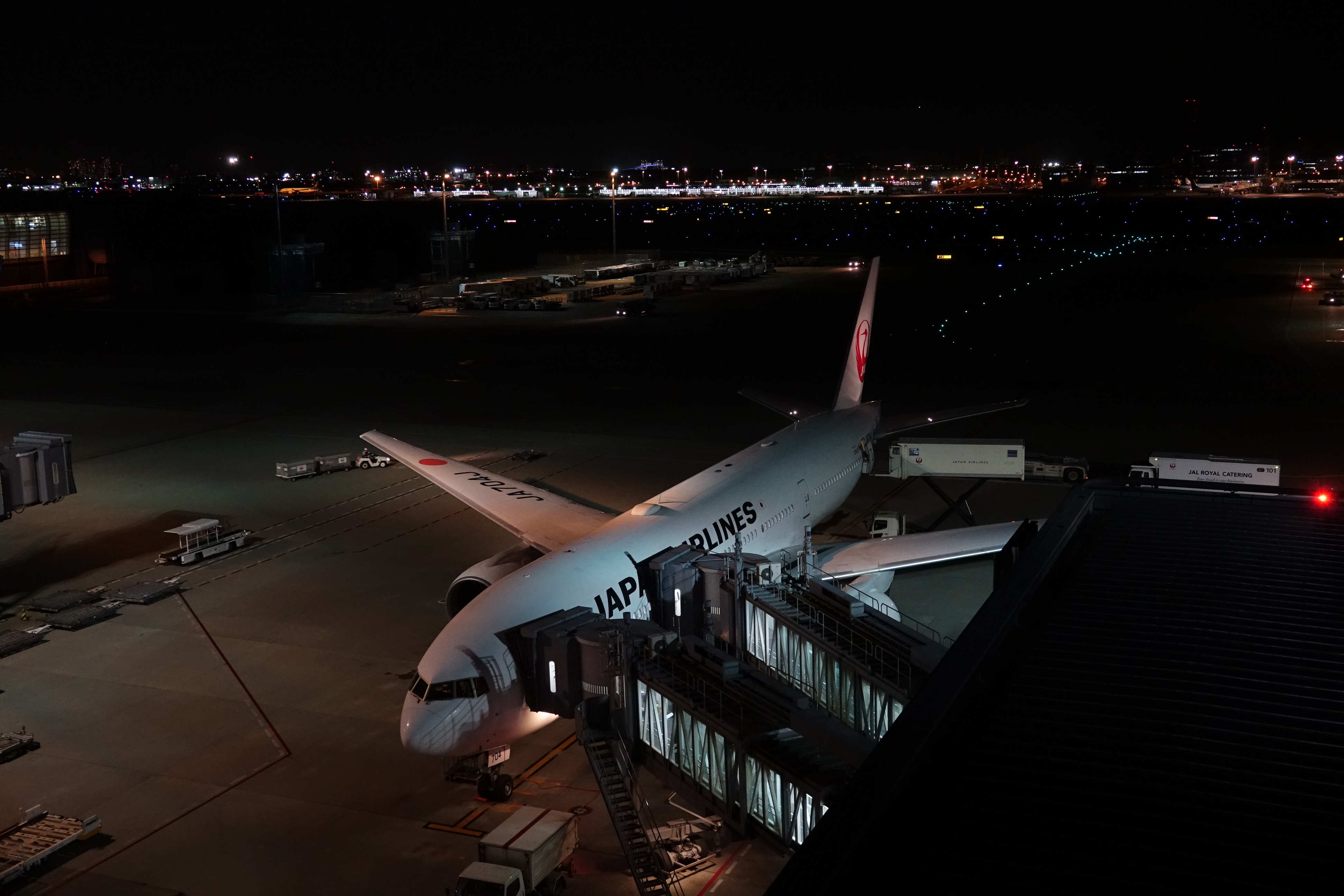 an airplane at an airport at night