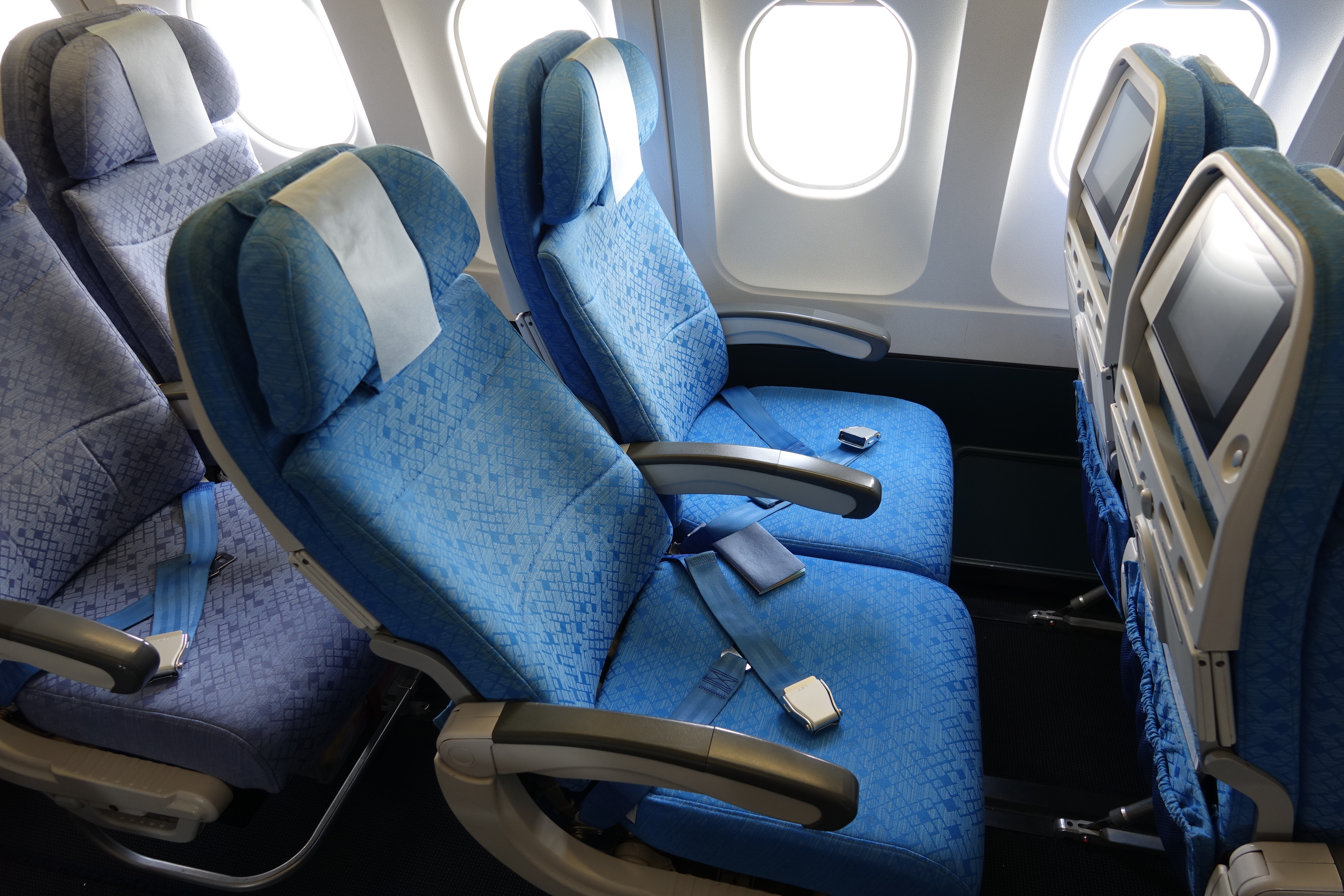 a blue seats in an airplane