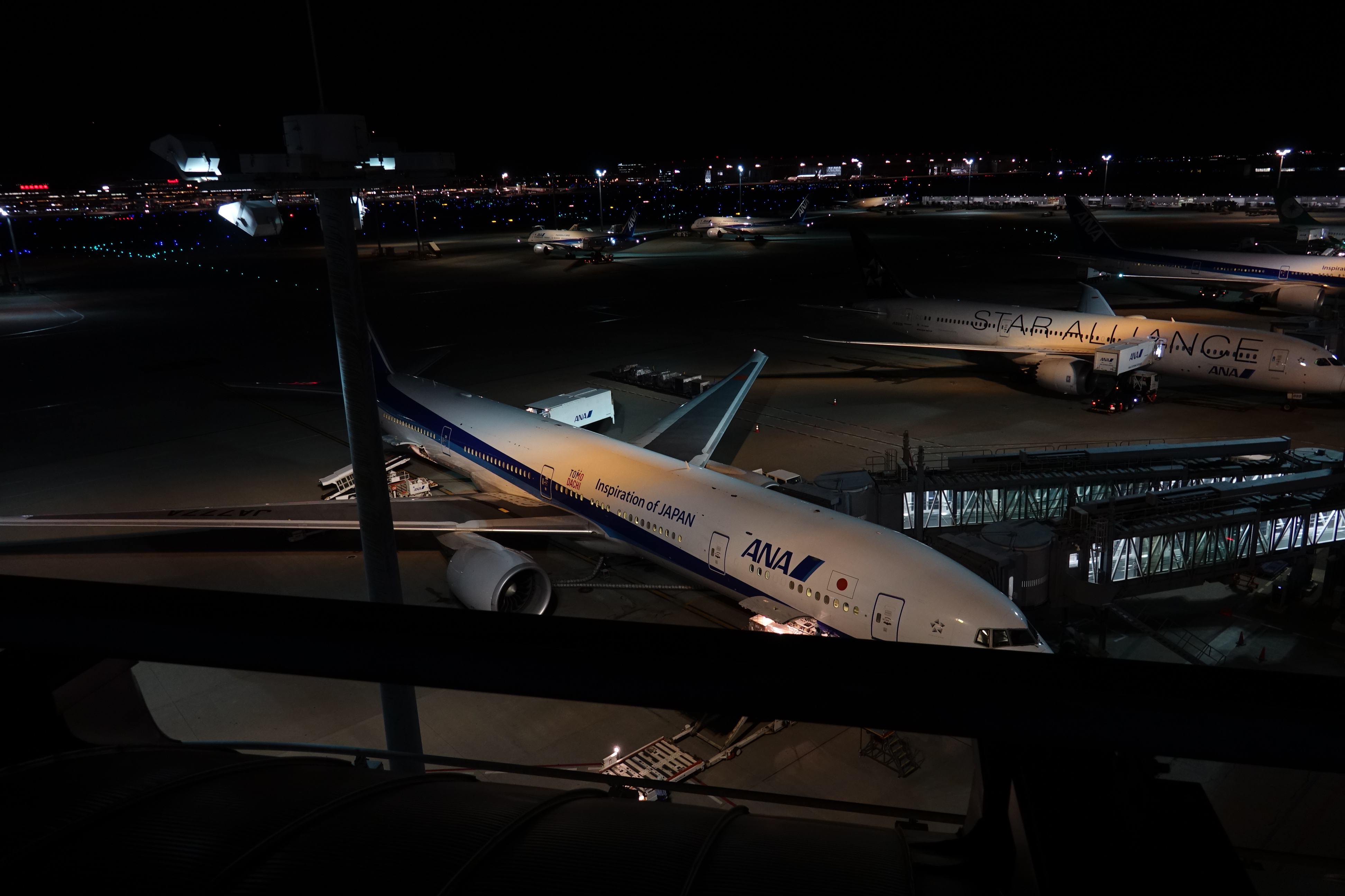 airplanes at an airport at night