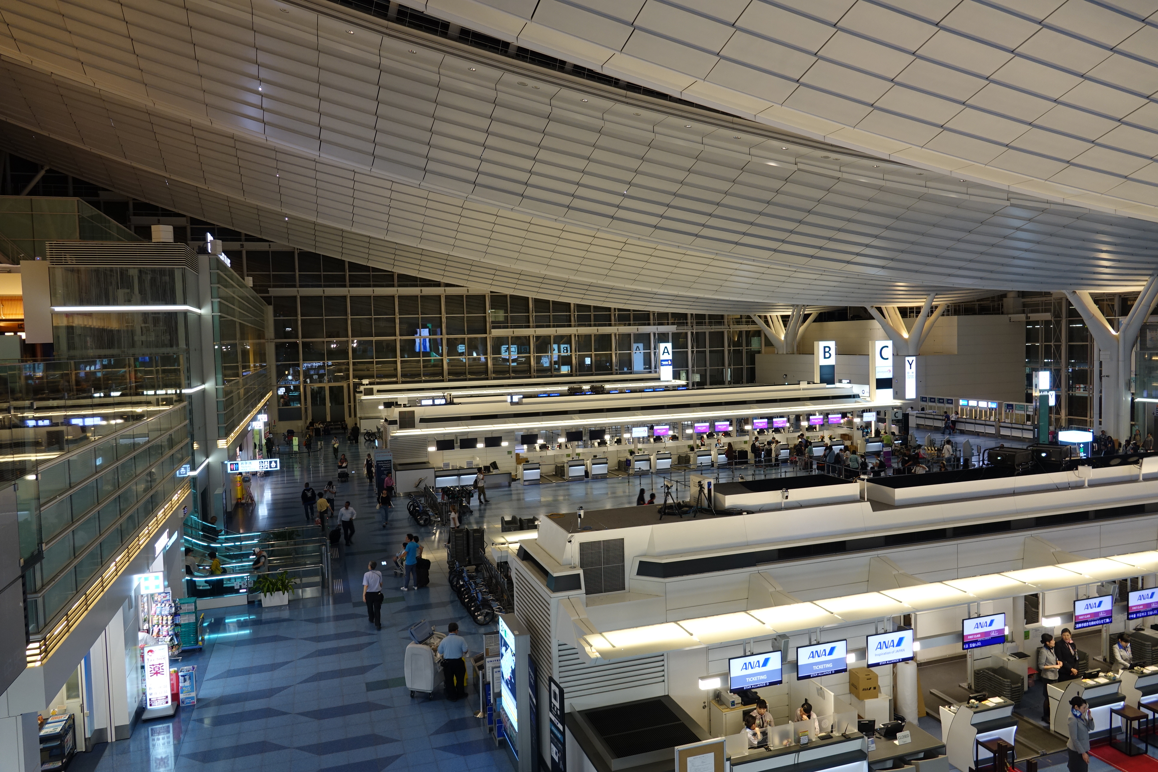 an airport with people walking around