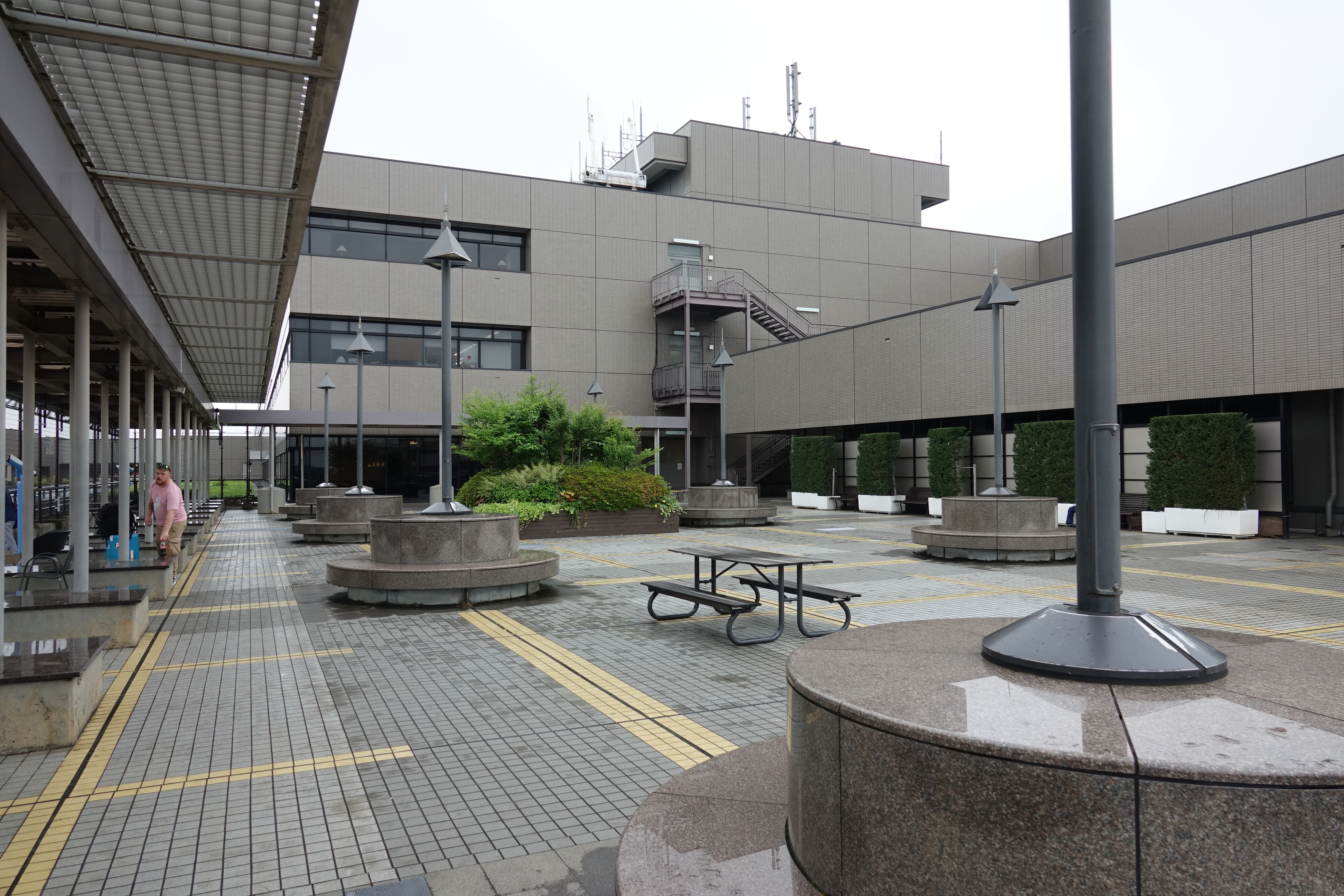 a building with a large building and benches