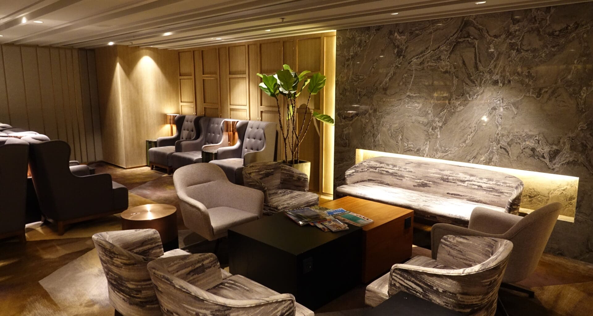 a room with a couch and chairs