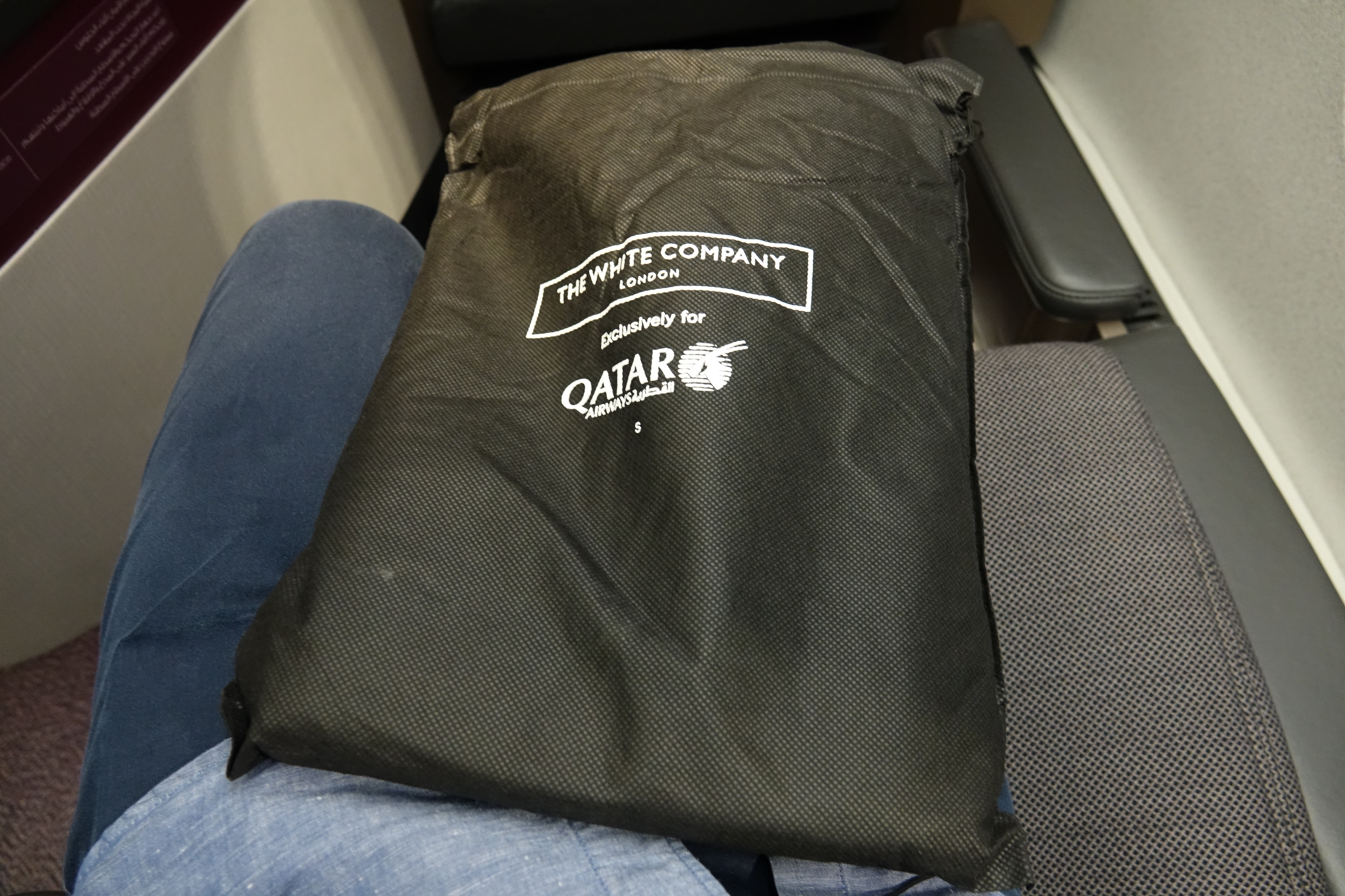 a black bag on a person's lap