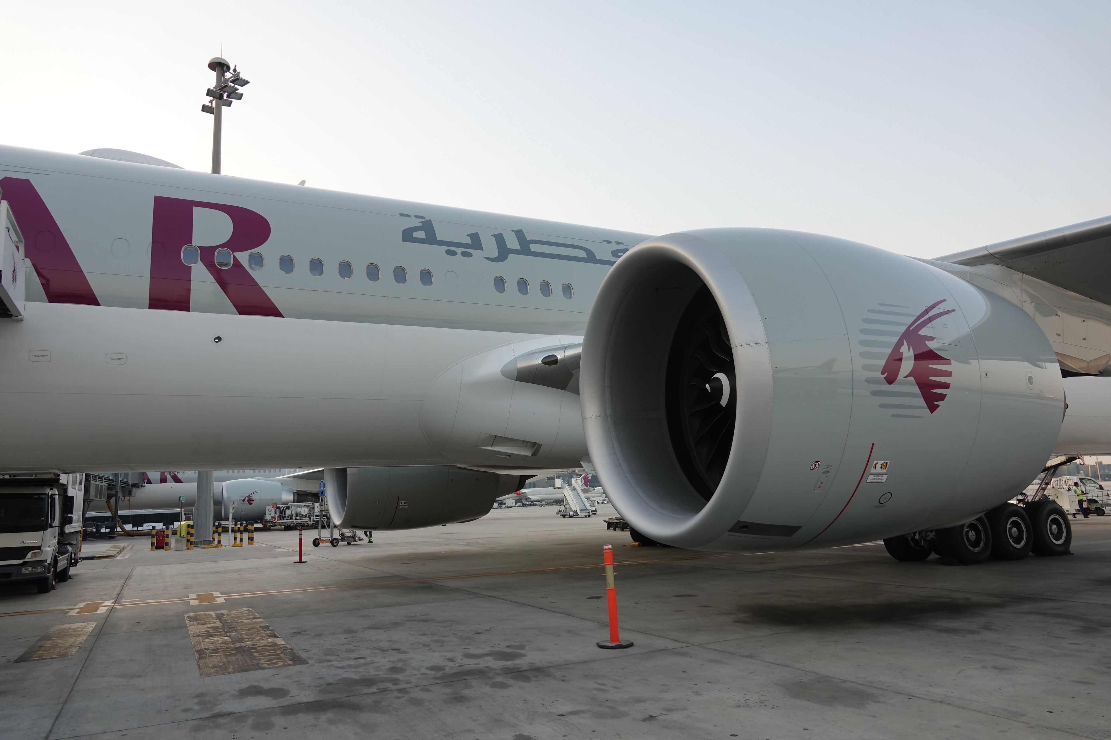 a large white airplane with red writing on it