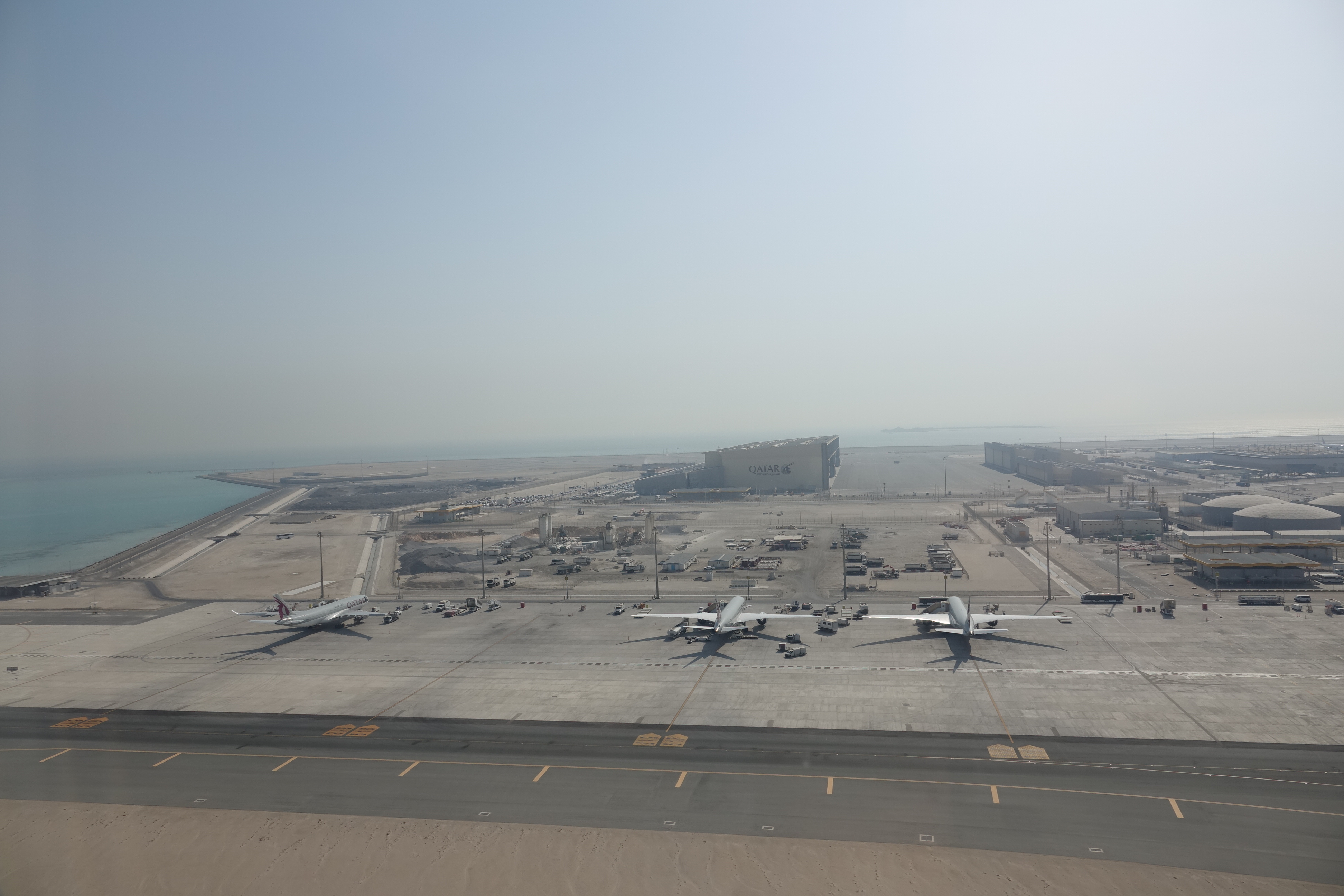 an airport with planes on the runway