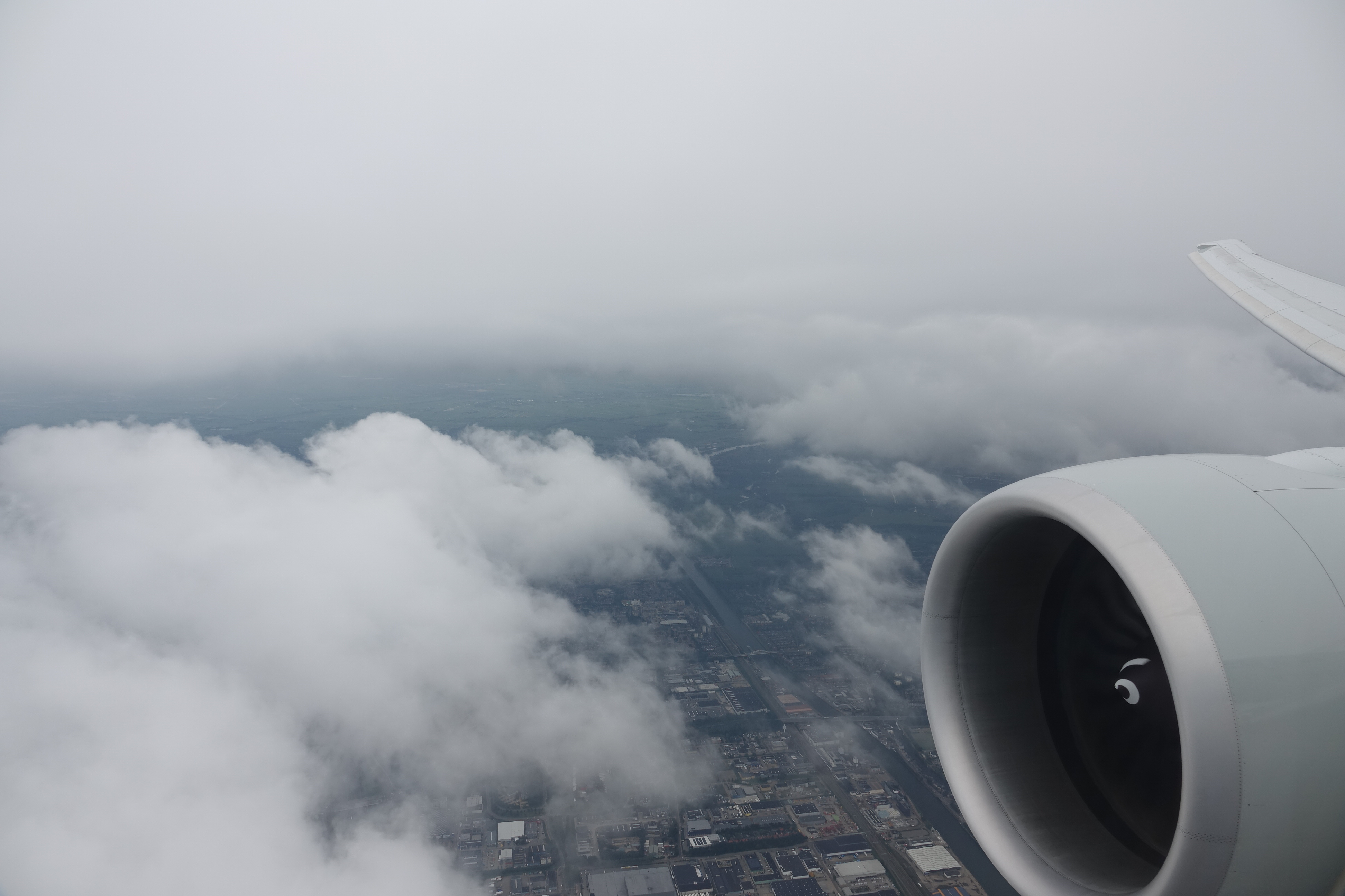 an airplane wing and clouds