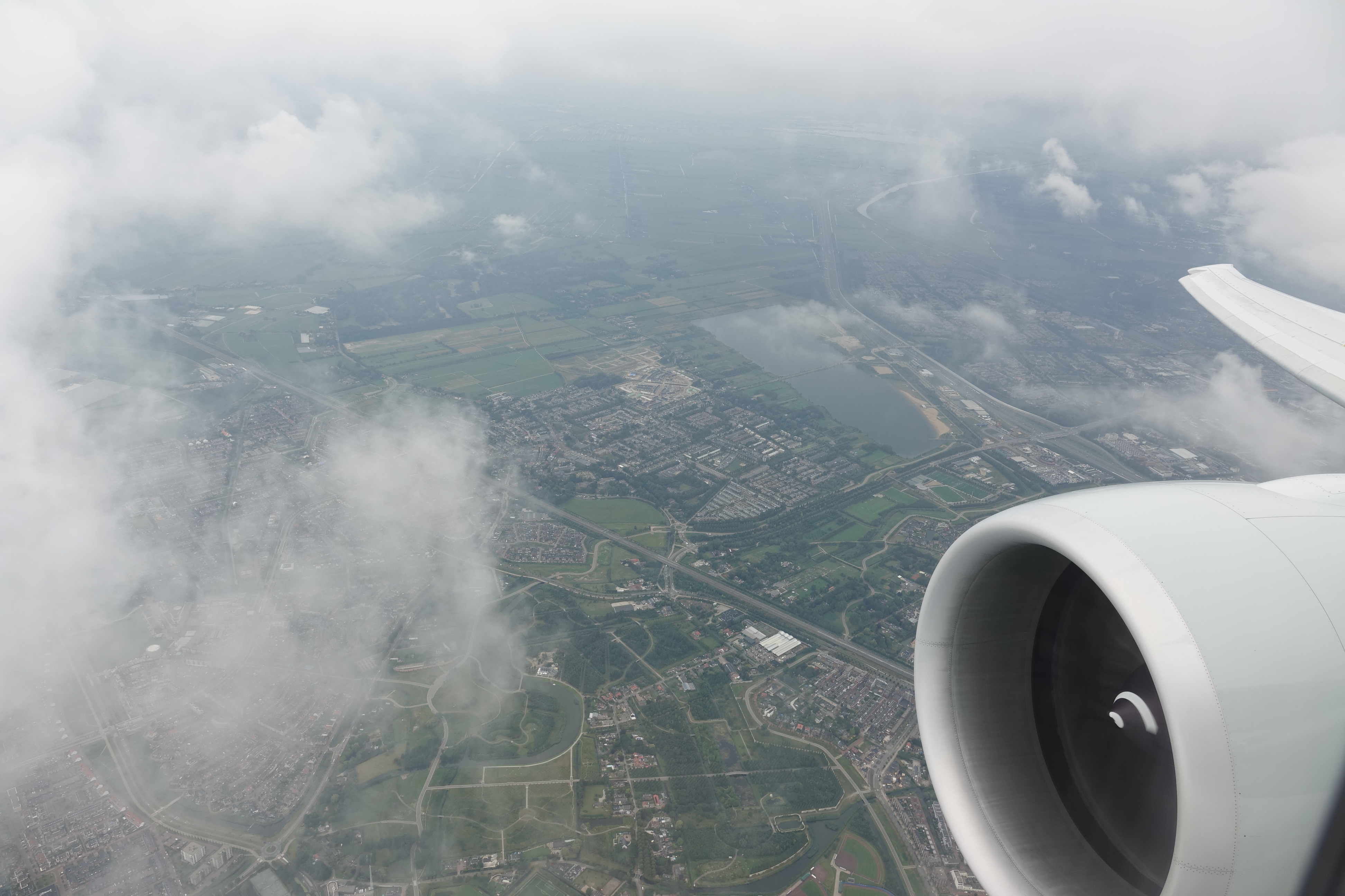 an airplane wing and a city