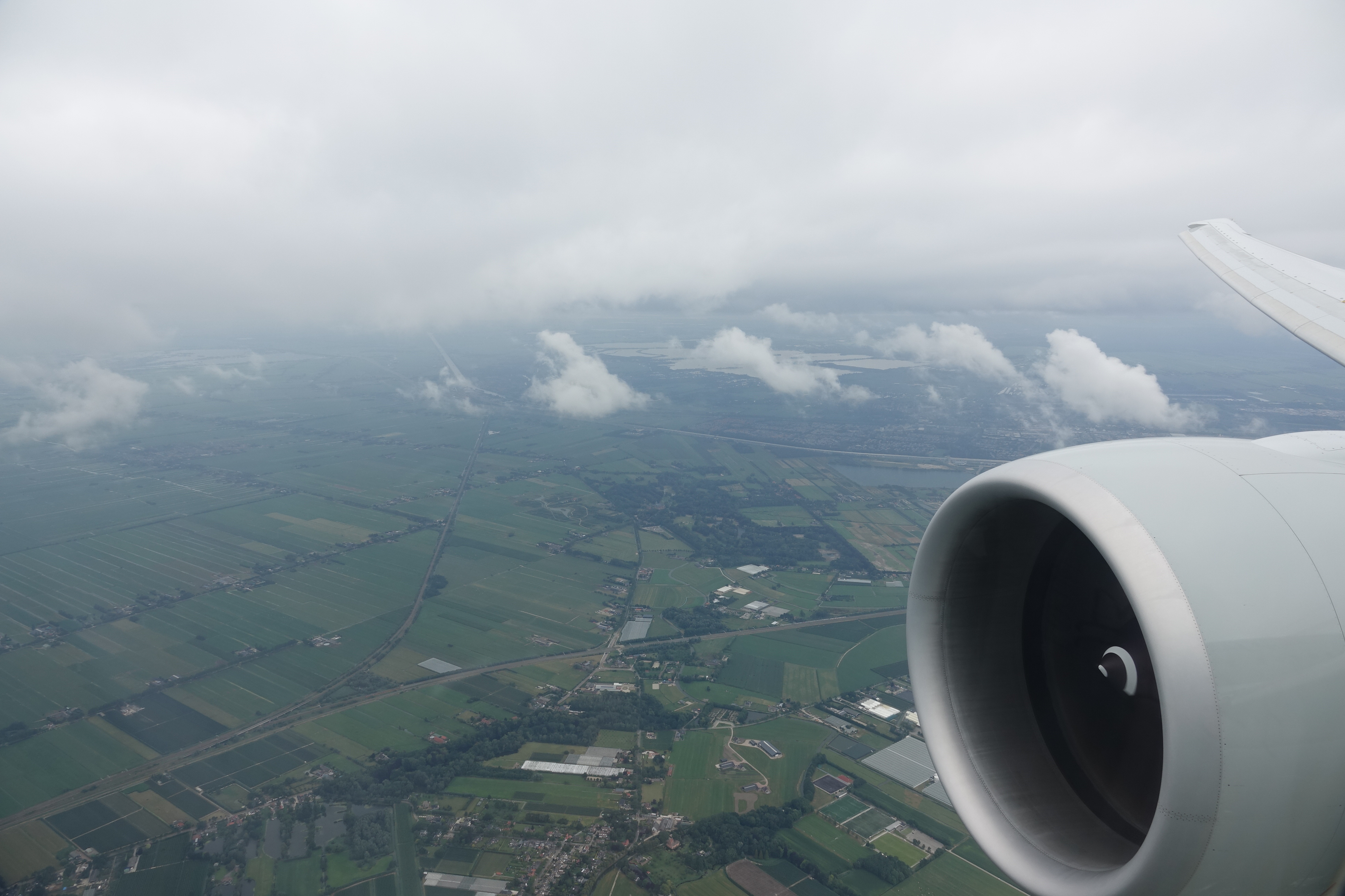 an airplane wing and a landscape