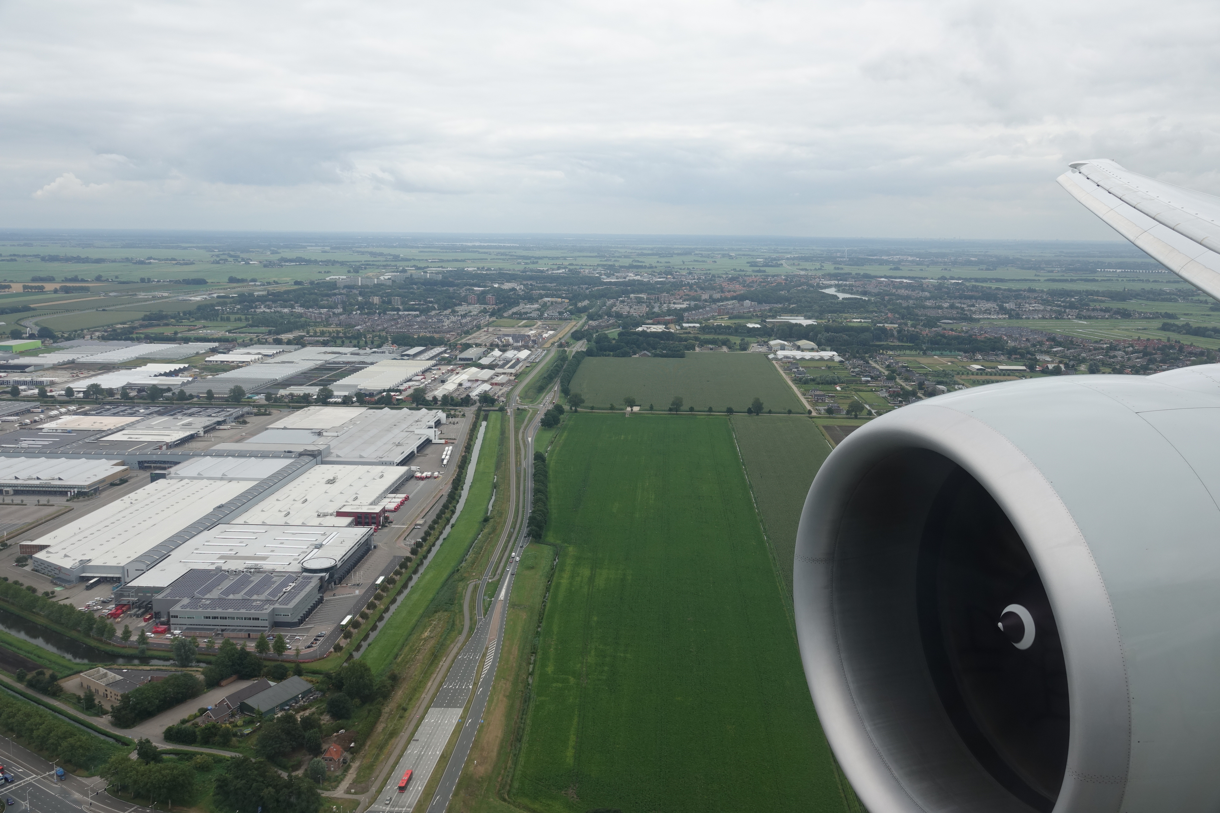 an airplane wing and a city