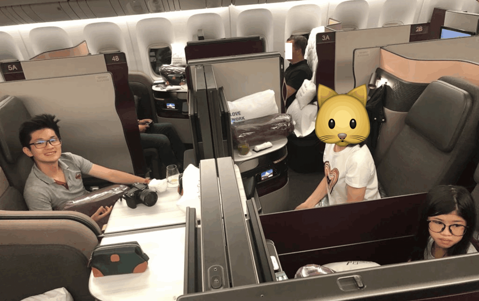 a group of people sitting in an airplane