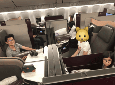 a group of people sitting in an airplane