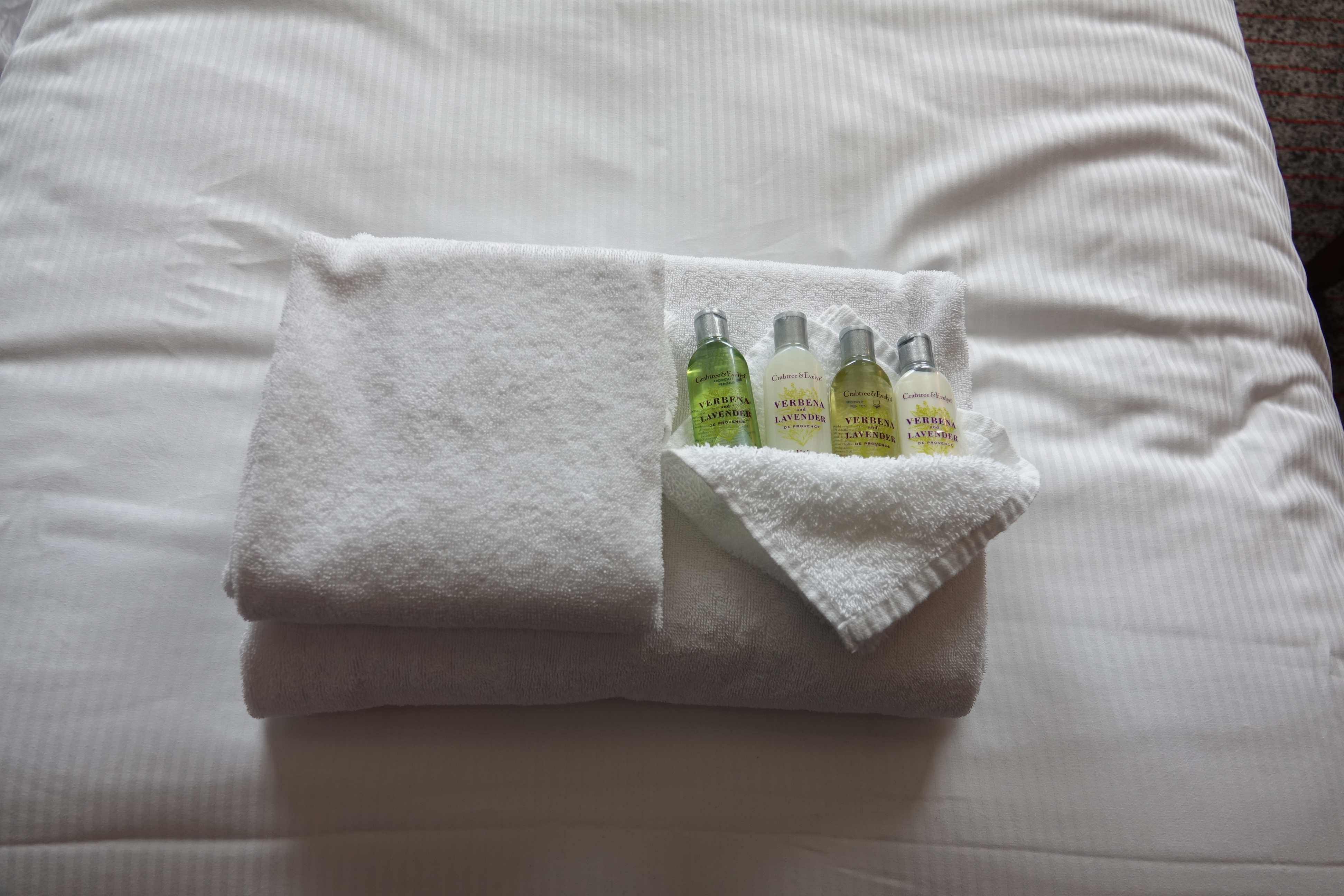 a group of small bottles on a towel