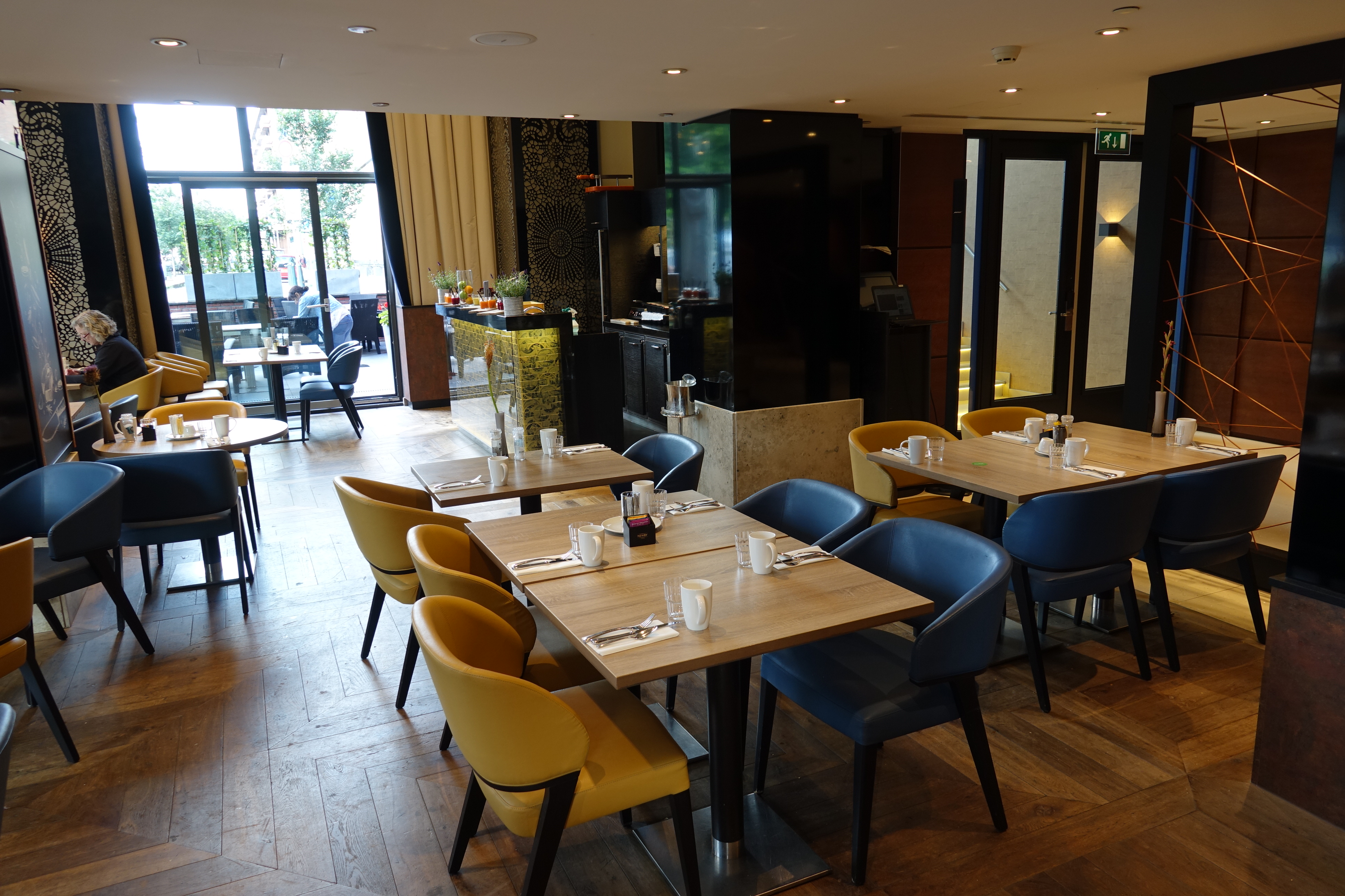 a restaurant with tables and chairs