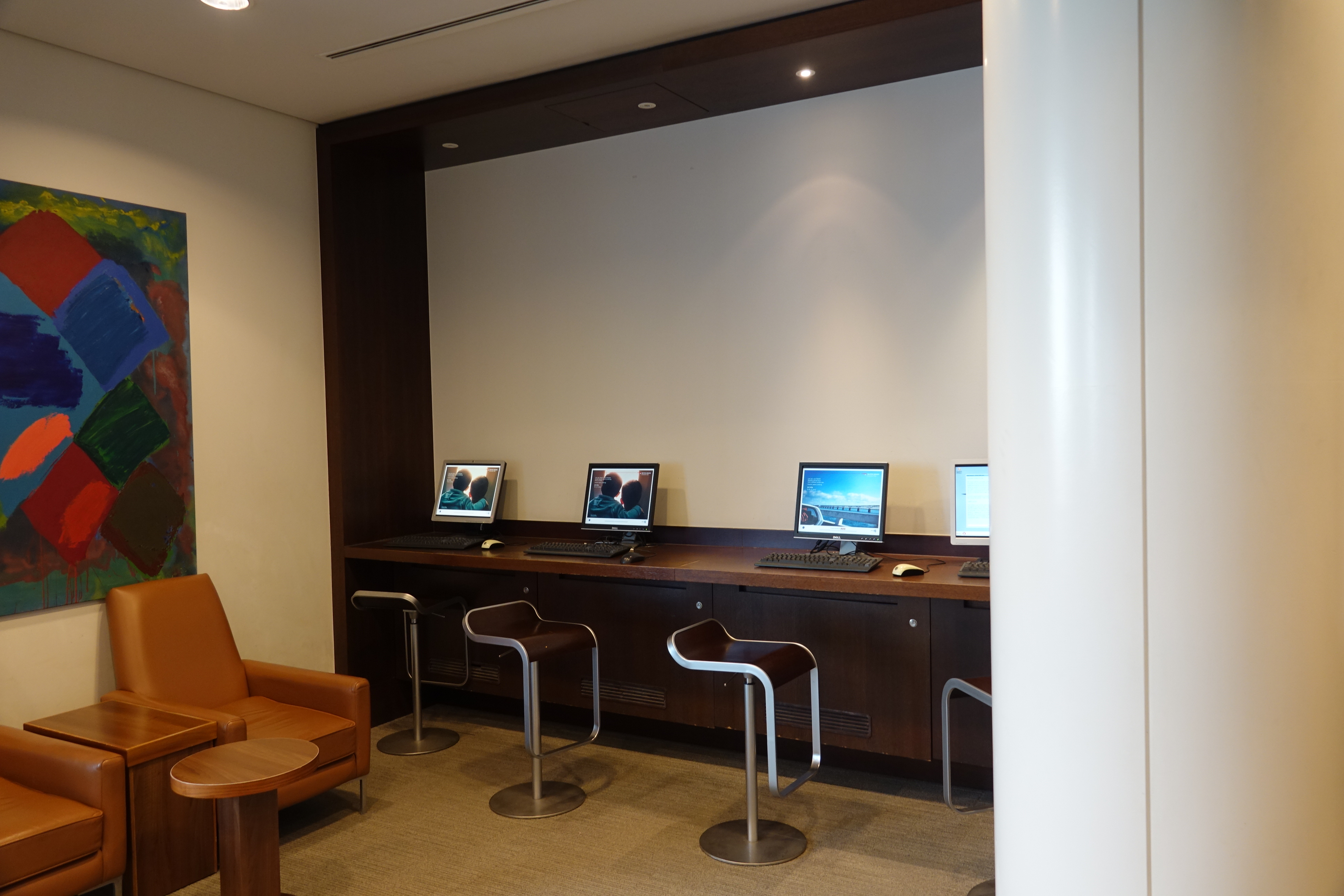 a row of computers on a desk