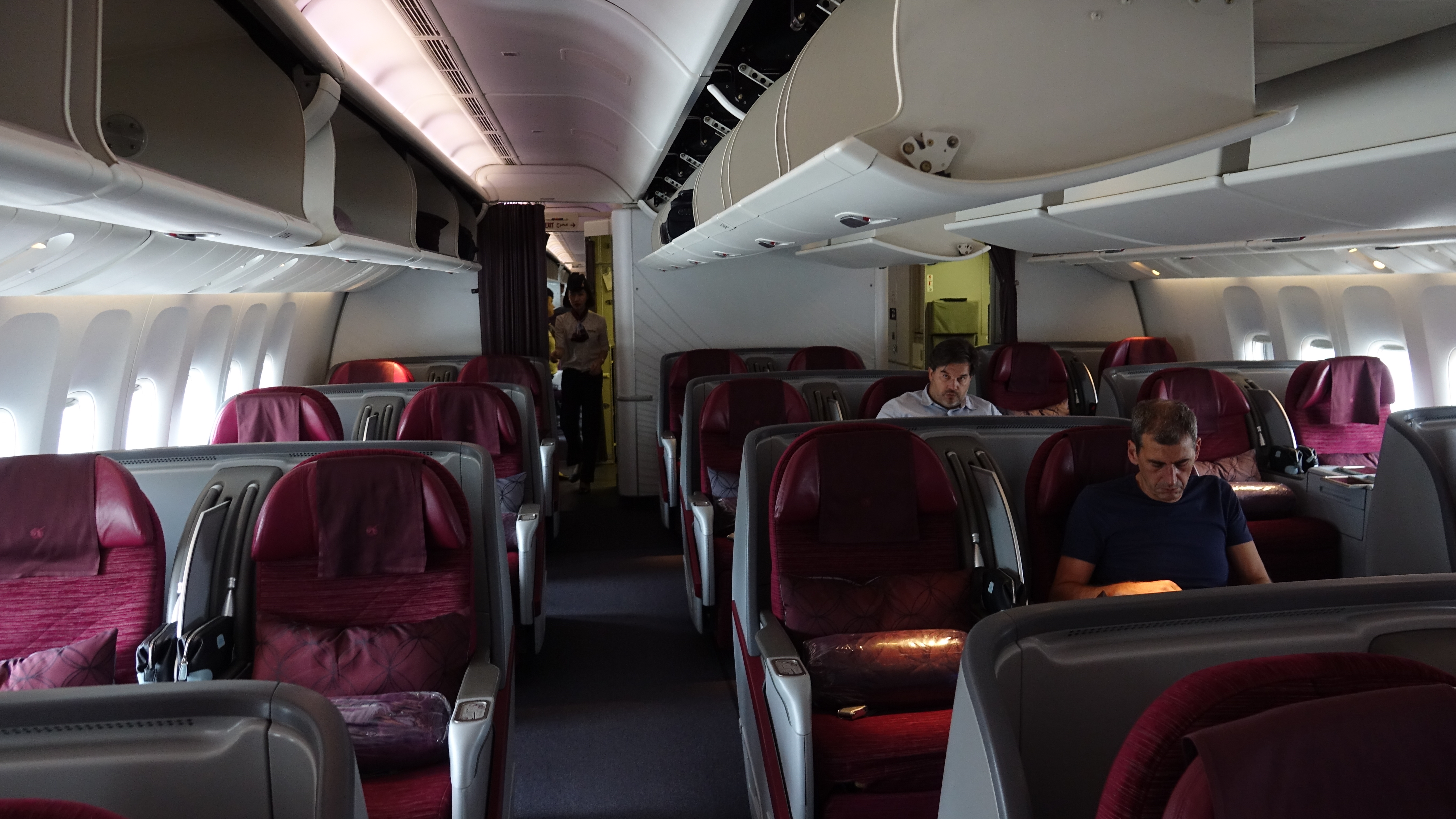 a group of people sitting in an airplane