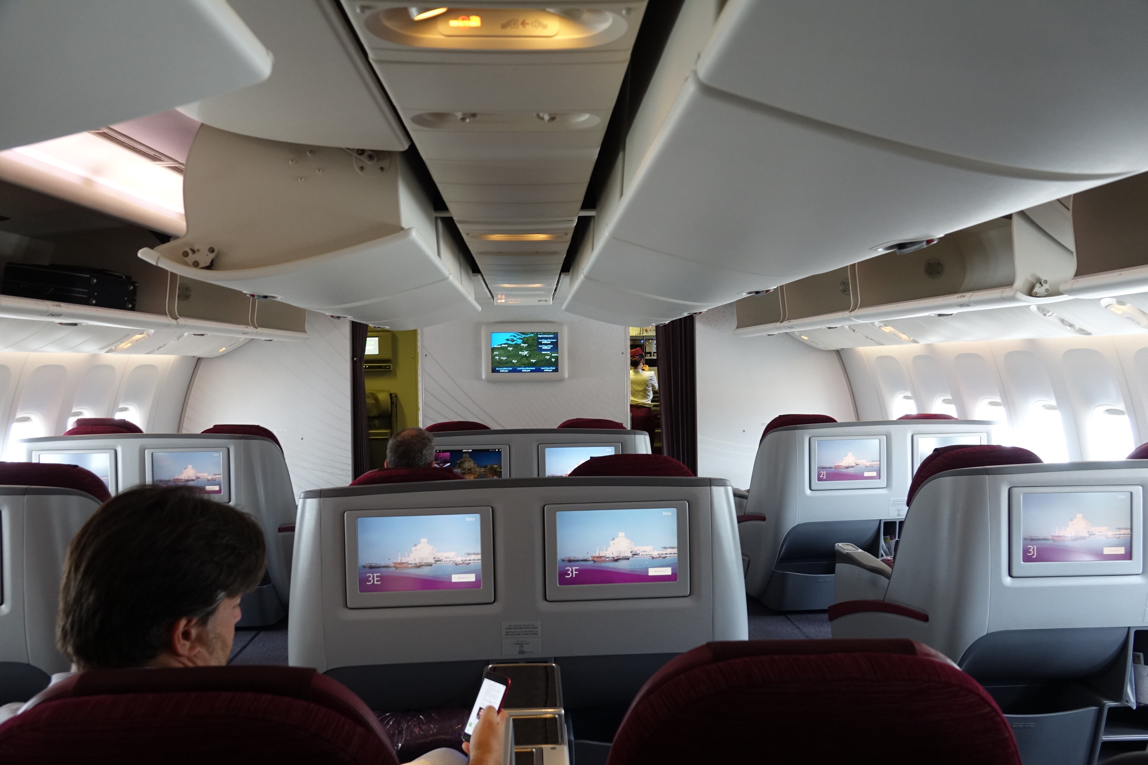 a group of people sitting in an airplane