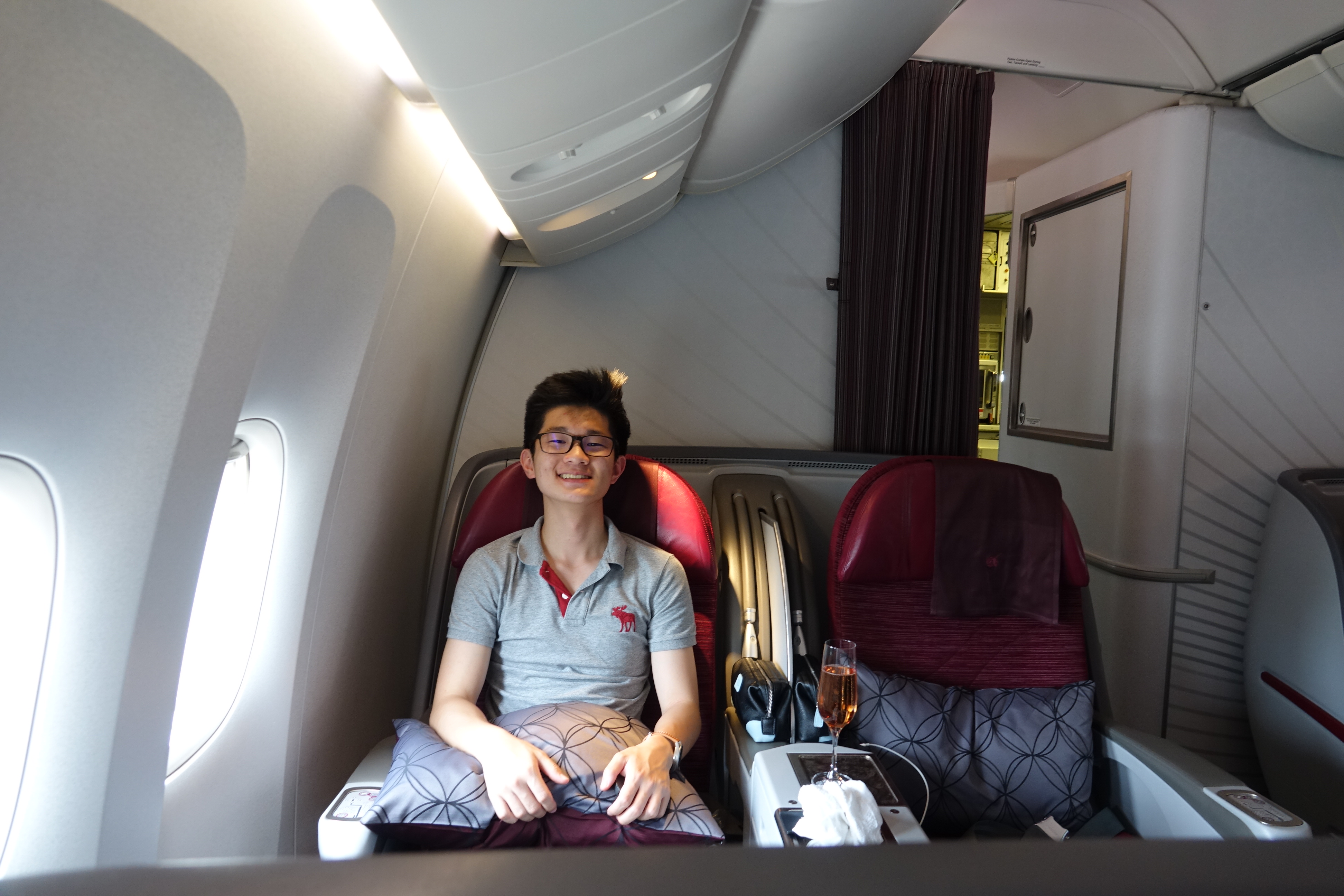 a man sitting in a chair in an airplane