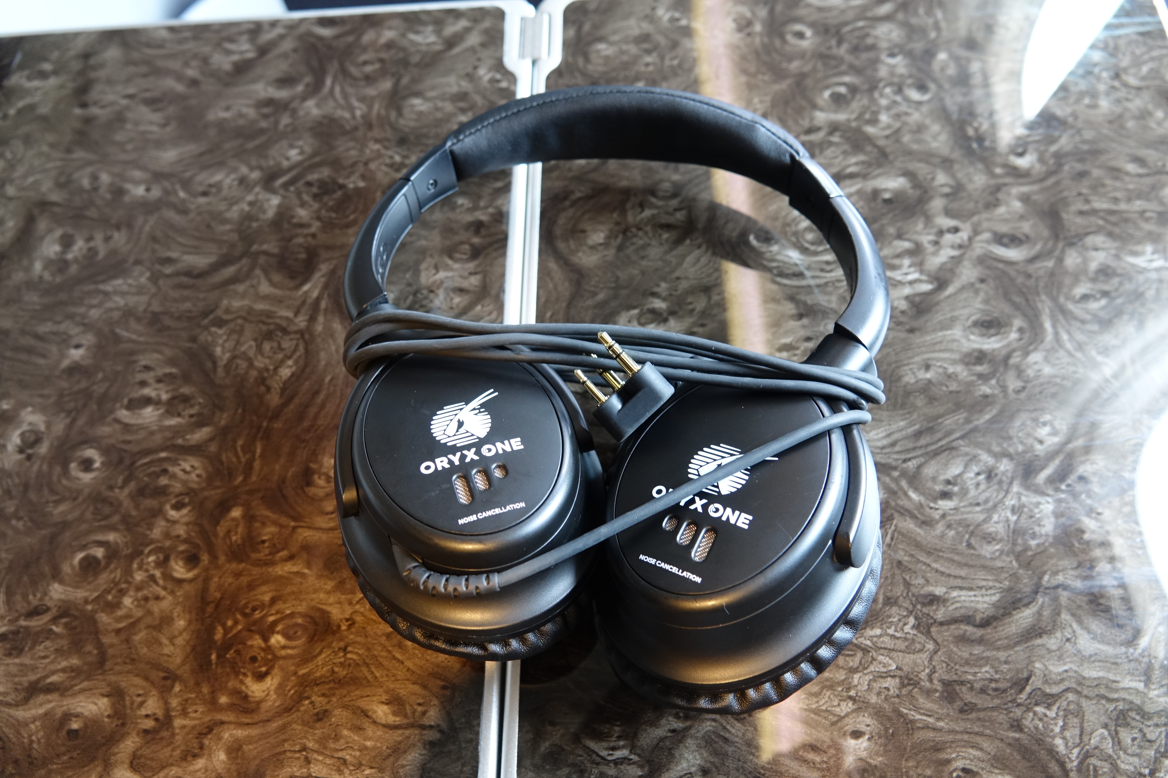 a pair of black headphones on a table