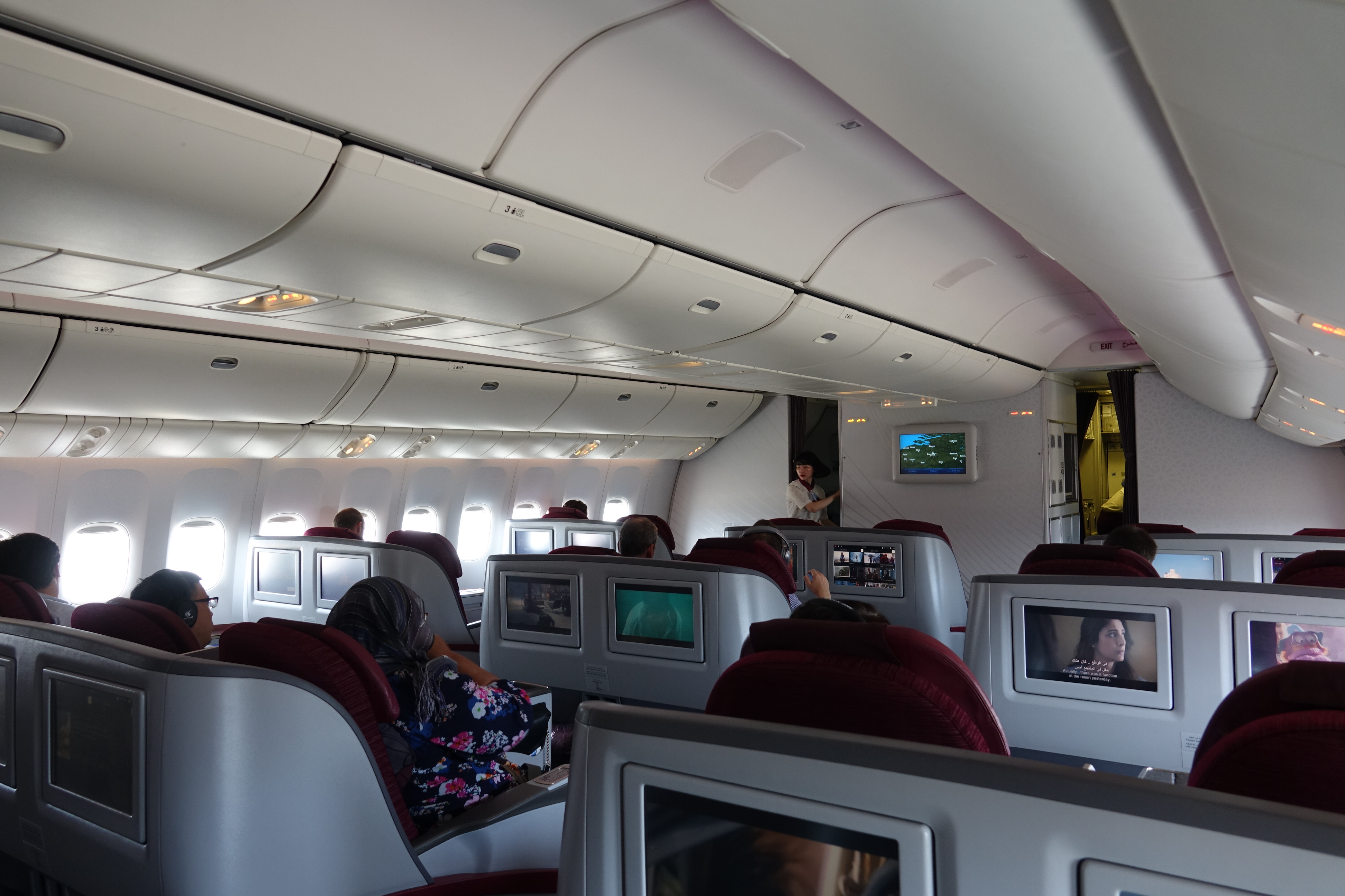 a group of people sitting in an airplane