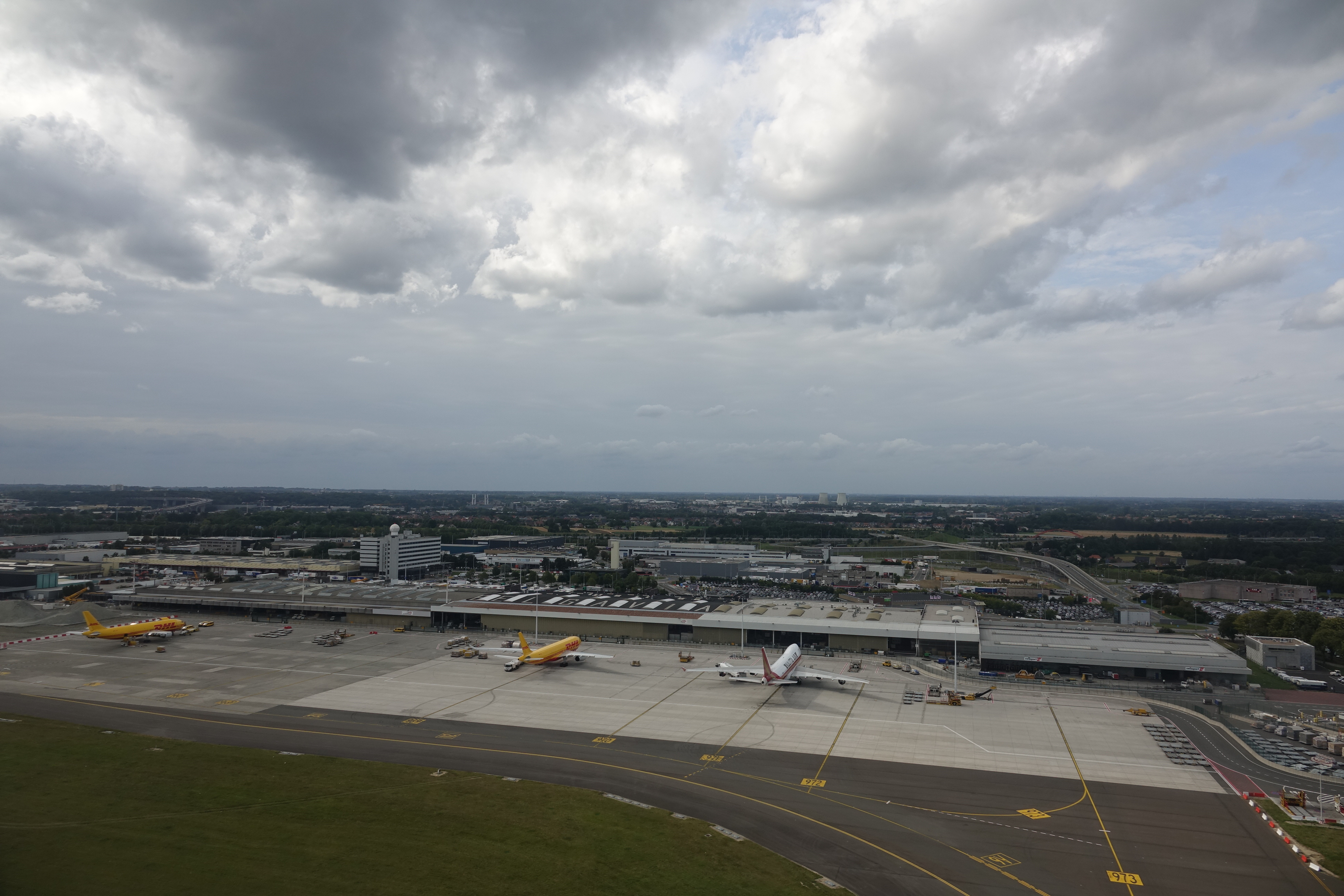 an airport with airplanes on the runway