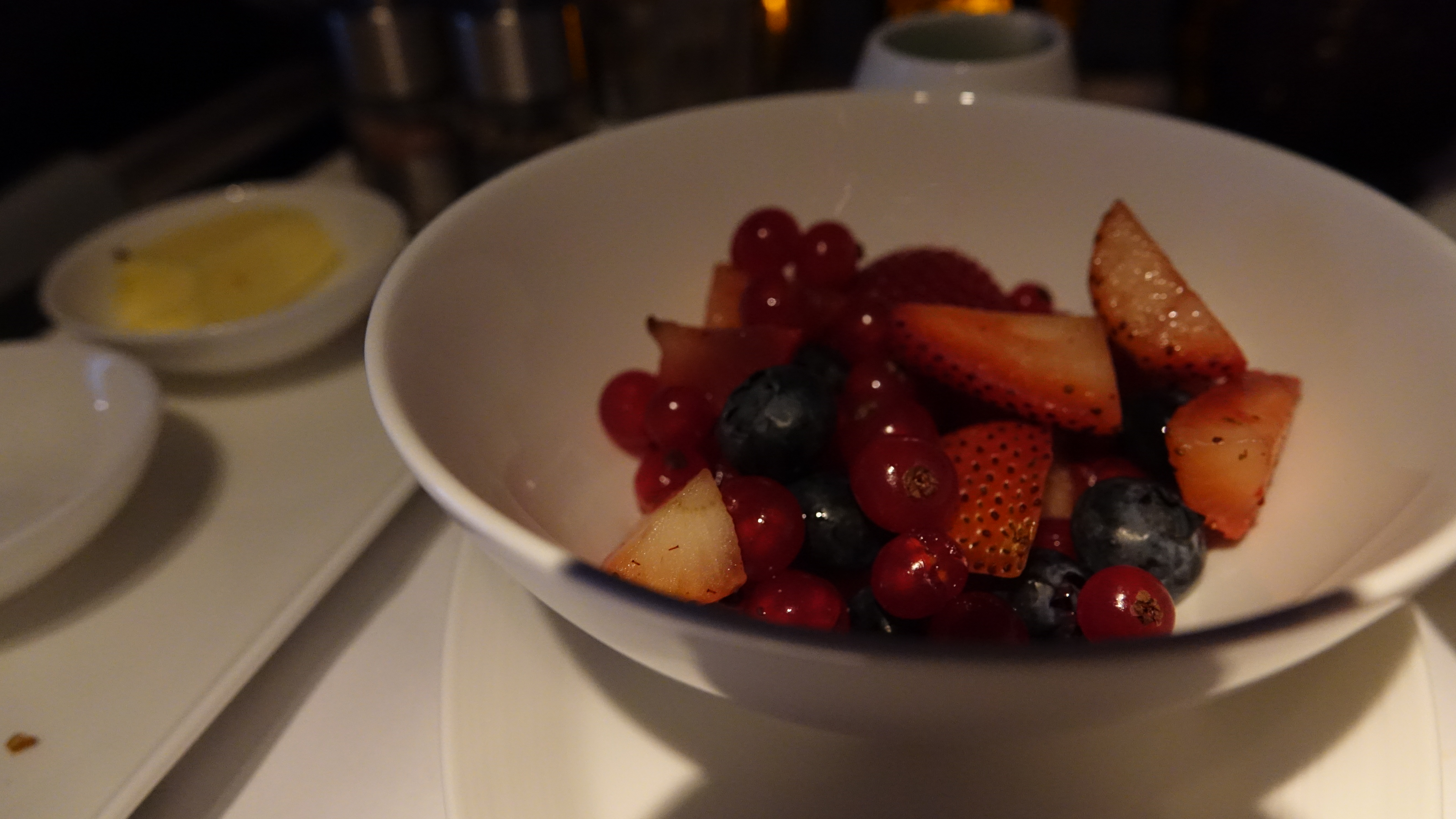 a bowl of fruit on a table