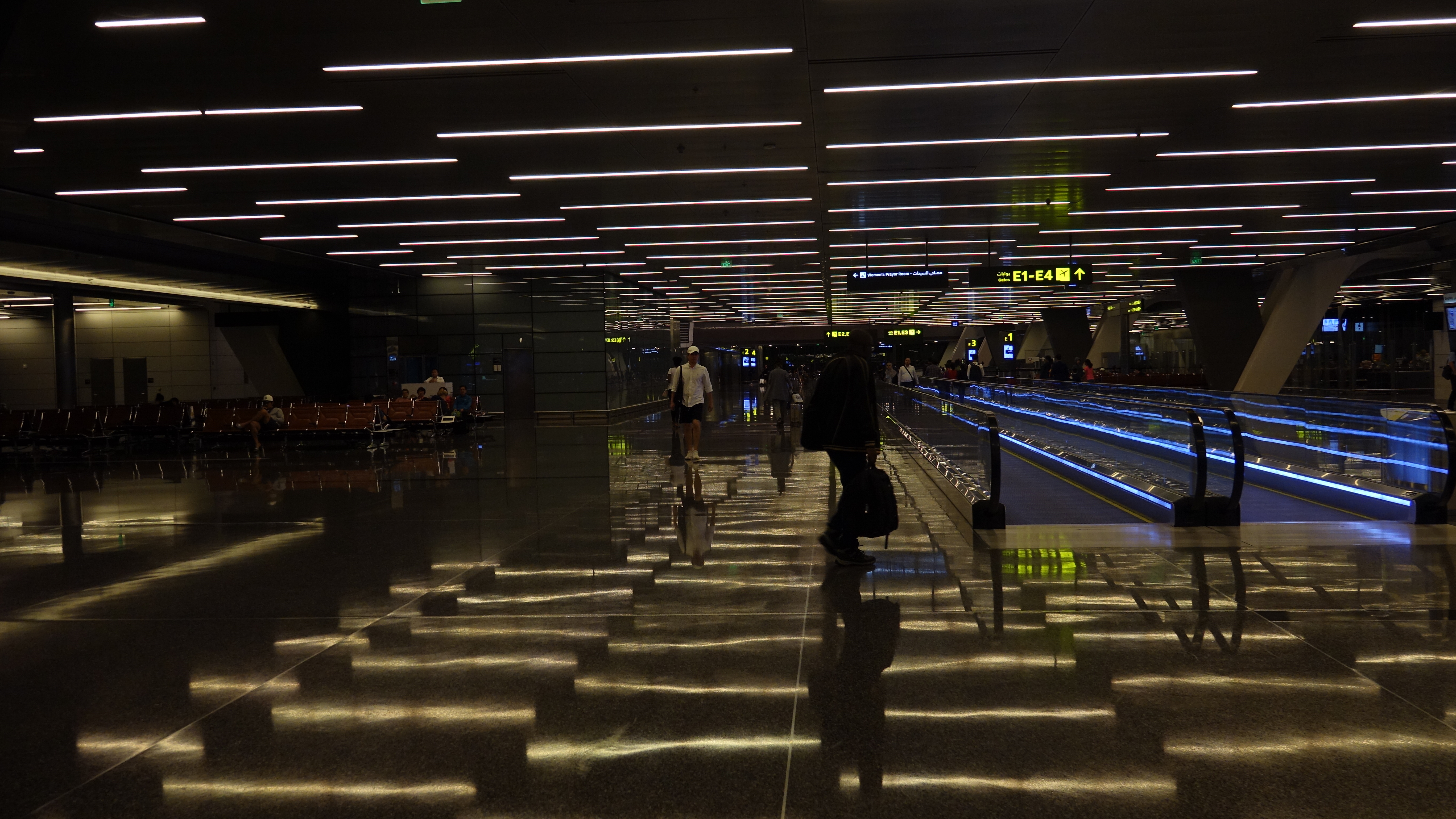 people walking in a large hall