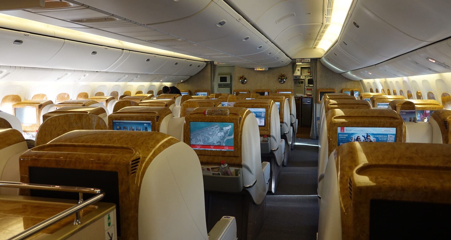 the inside of an airplane with a television screen