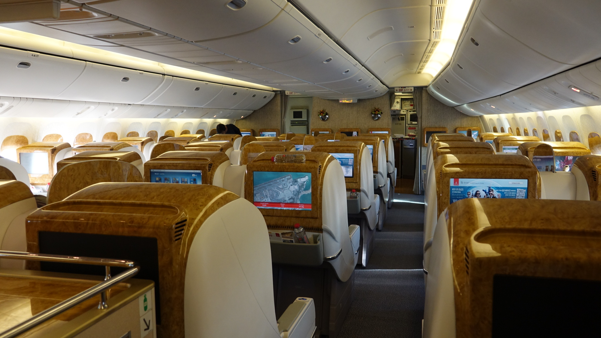 the inside of an airplane with a television screen