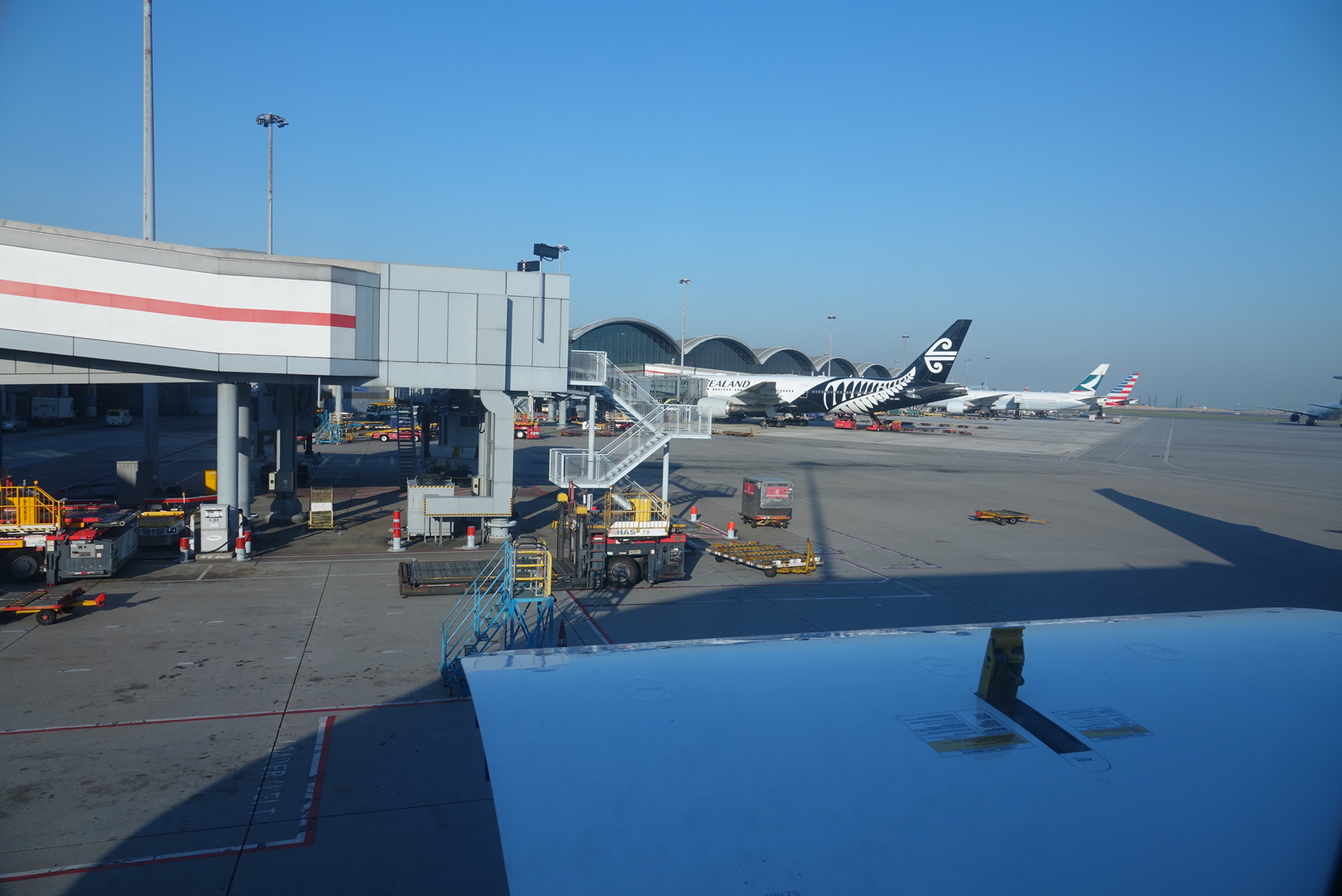 an airport with airplanes parked on the ground