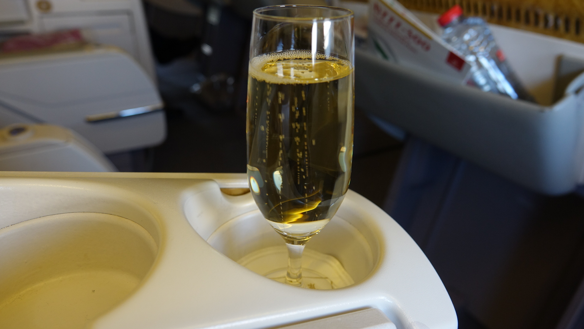 a glass of champagne on a tray