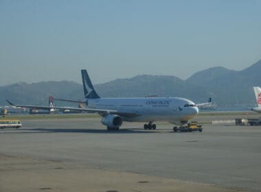 a white airplane on a runway
