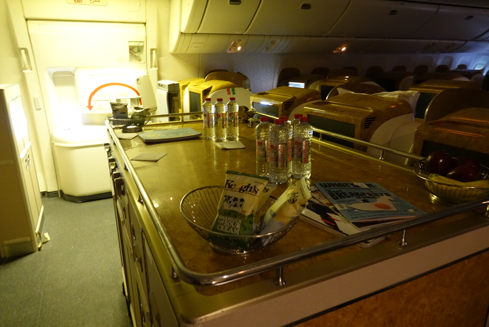 a table with bottles and a bowl on it