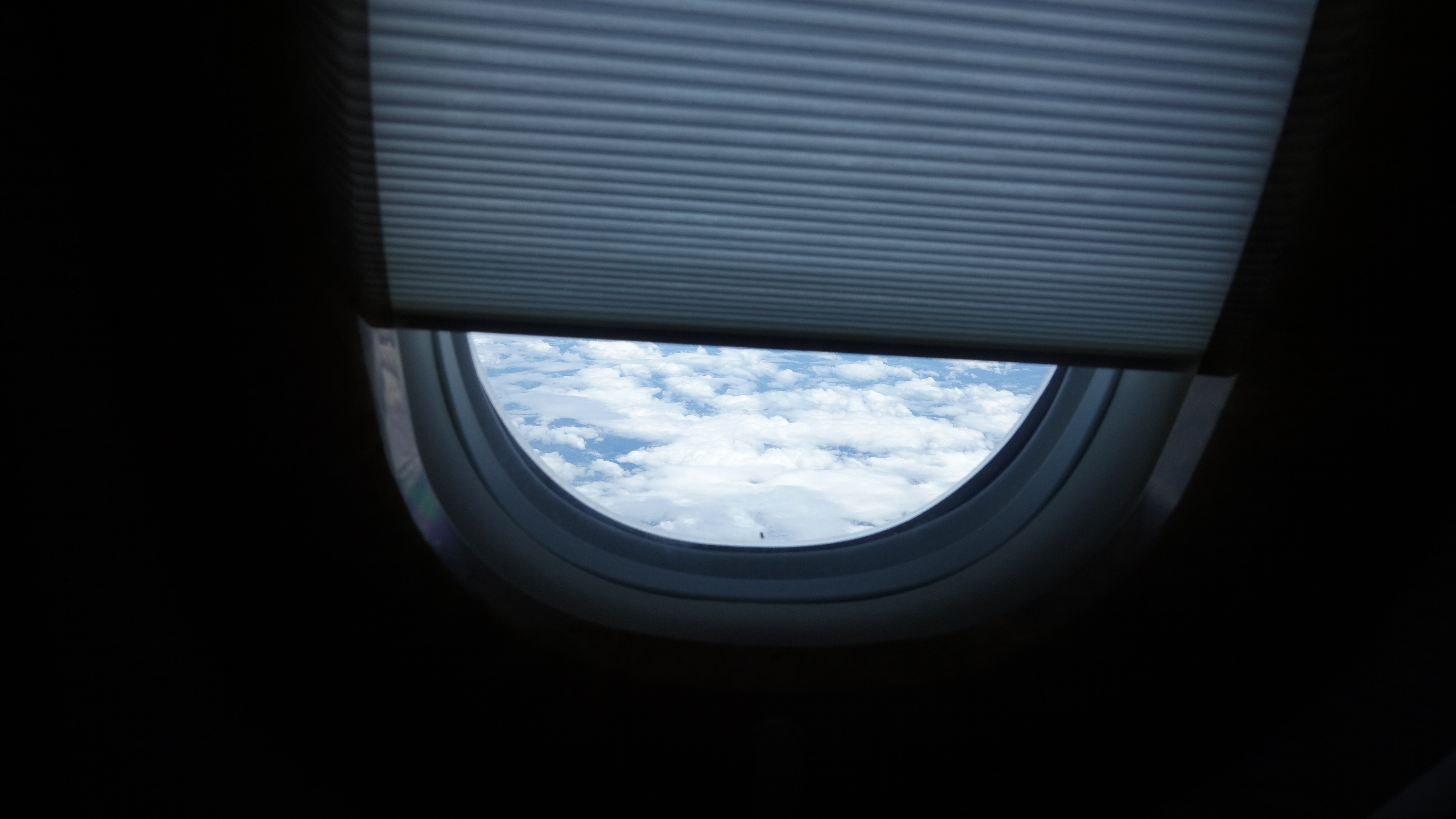 a window with clouds in the sky