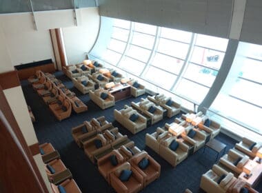 a room with many chairs and tables