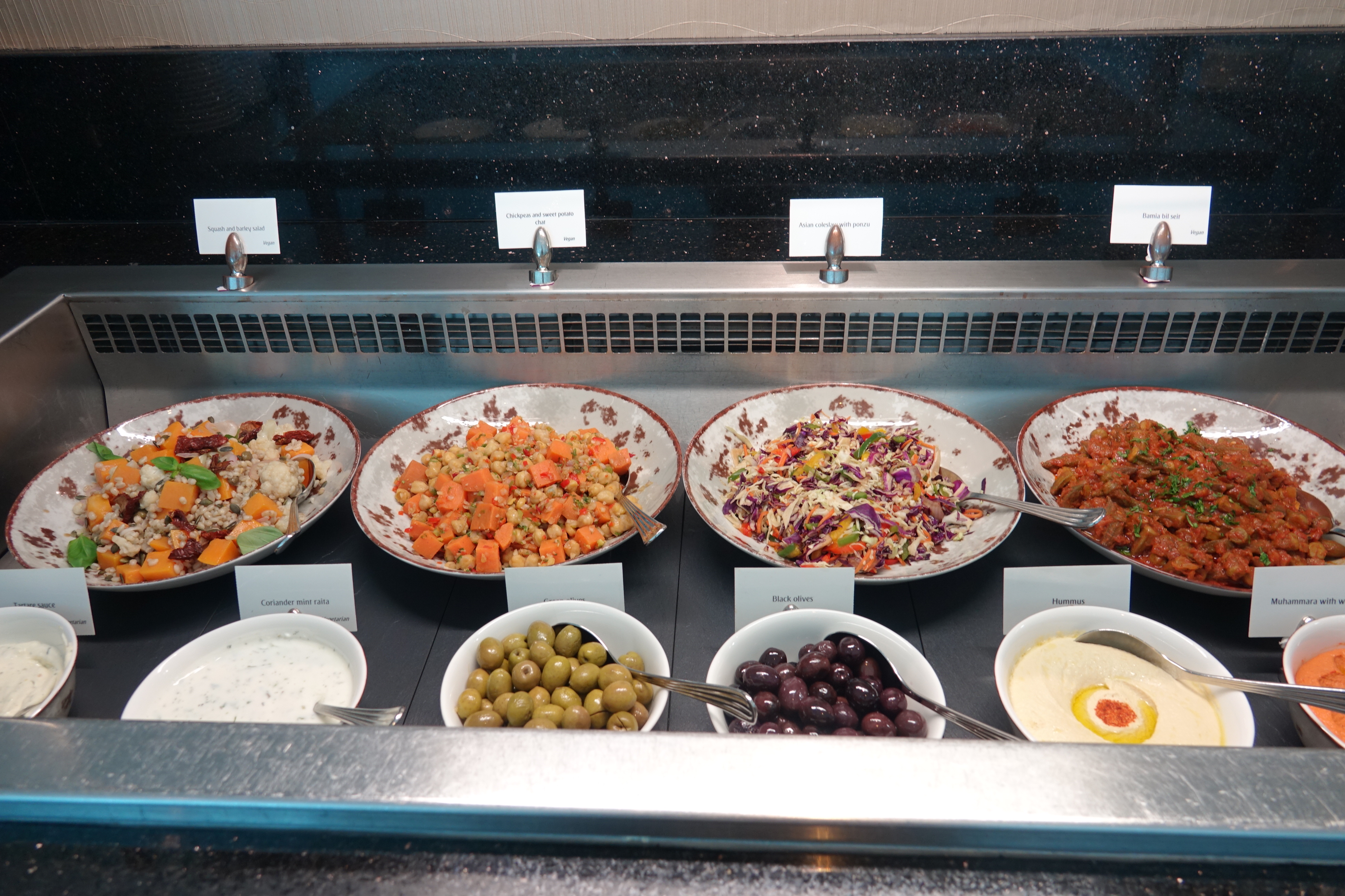 a row of bowls of food