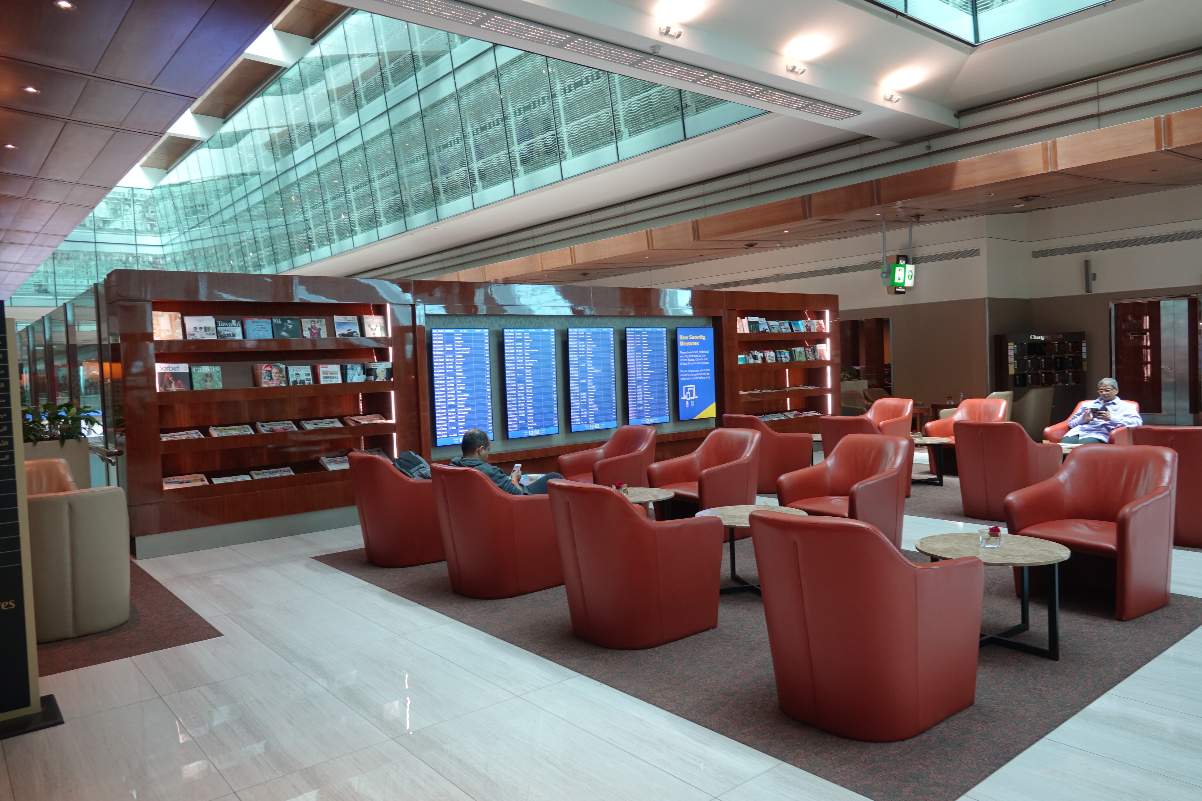 a room with red chairs and tables